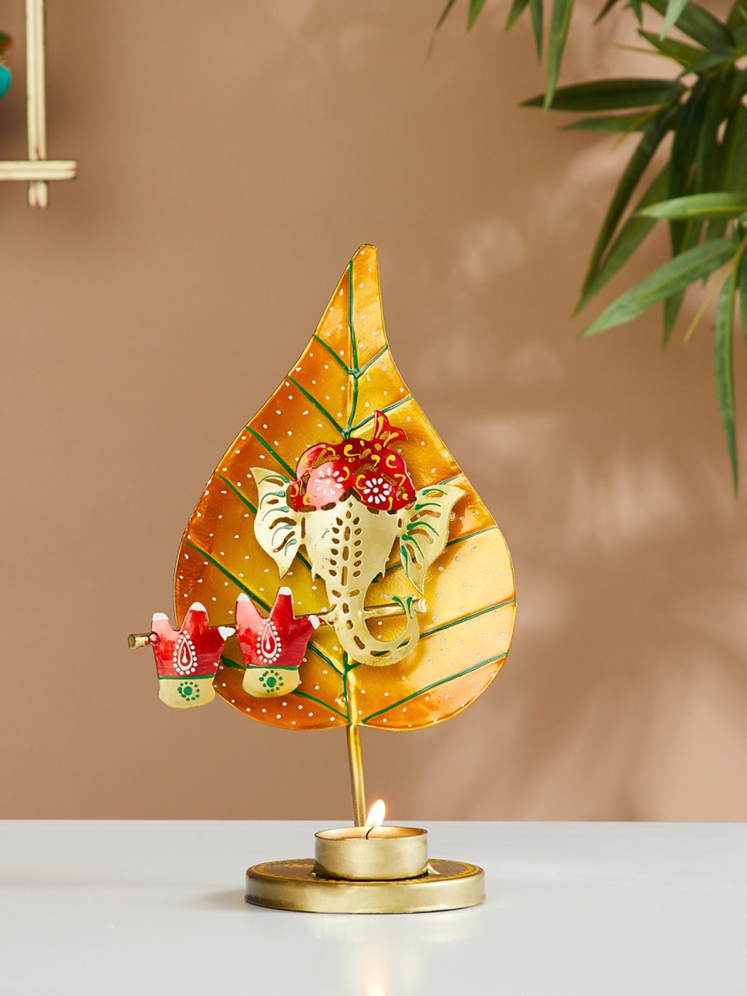 

Home Centre Red & Green Ganesha Metal Embellished T-Light Candle Holder, Gold