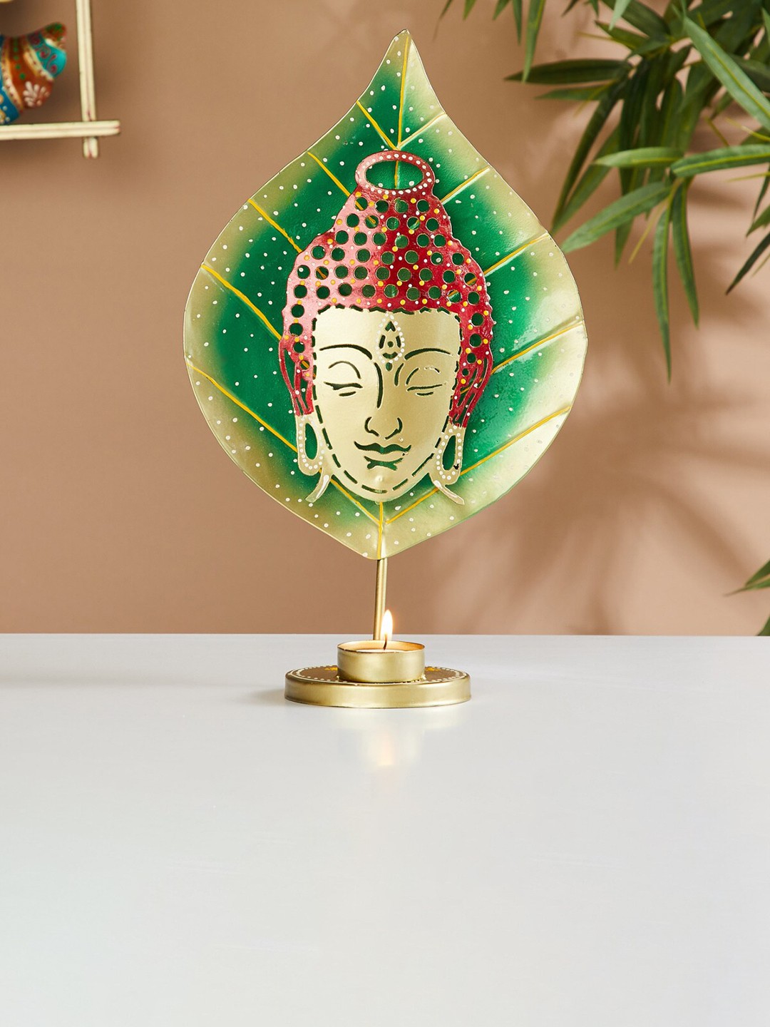

Home Centre Green & Red Textured Leaf Buddha T-Light Candle Holder