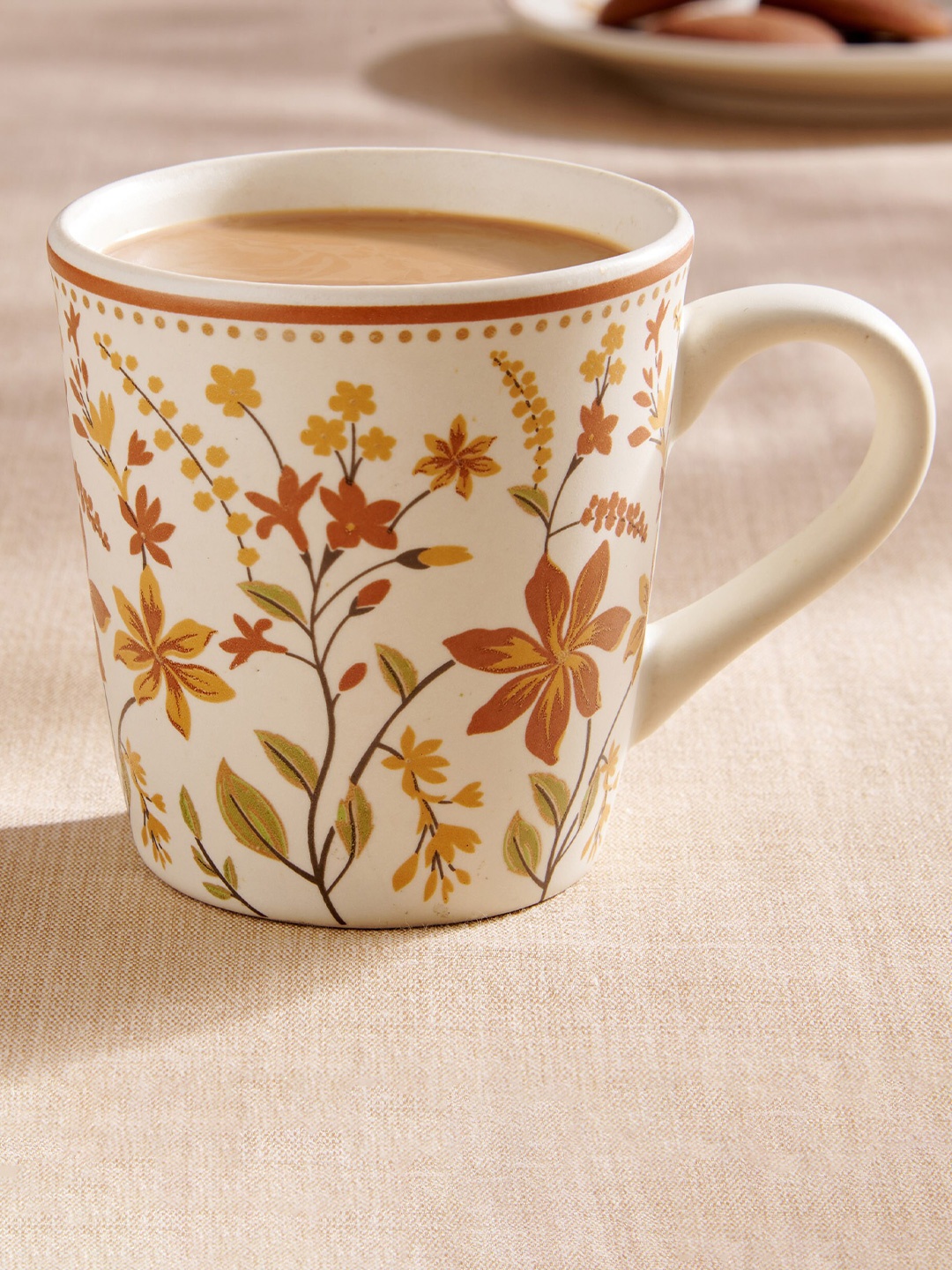 

Home Centre Mohar White & Orange Floral Printed Stoneware Glossy Mug 320 ml