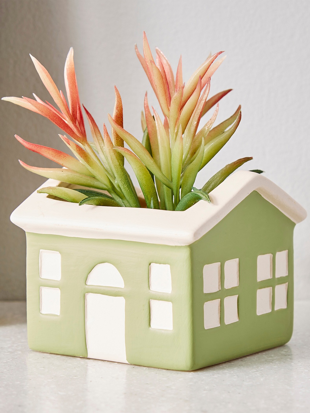 

Home Centre Corsica Green Ceramic House Planter