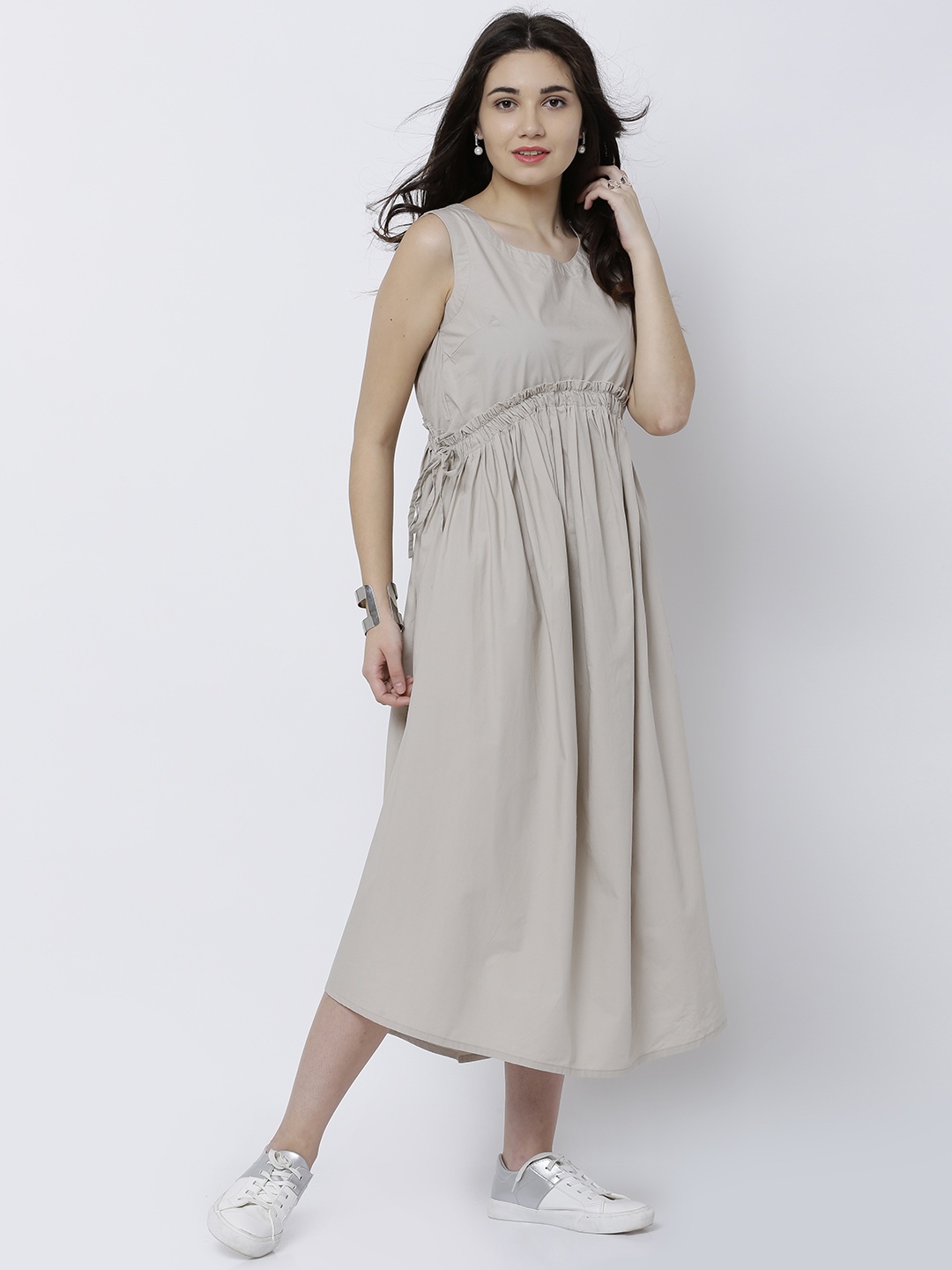 

Tokyo Talkies Women Beige Solid Fit and Flare Dress