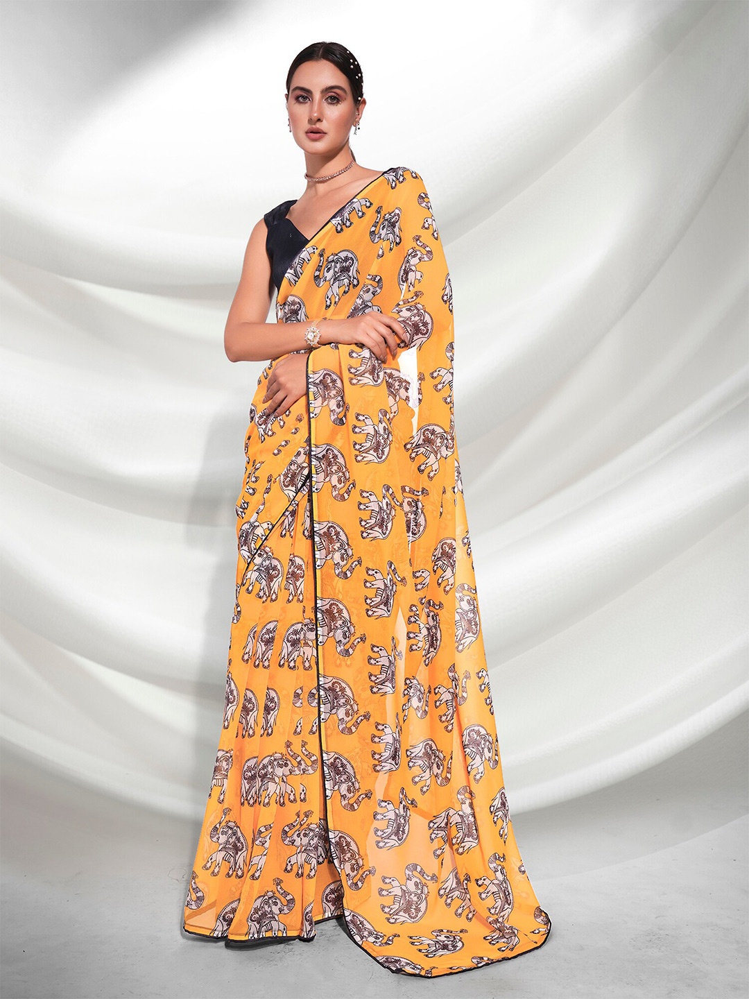 

Kalista Yellow & Black Ethnic Motifs Printed Pure Georgette Saree
