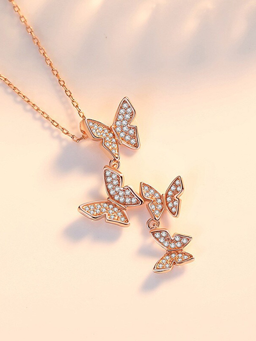 

MYKI Rose Gold-Plated Cubic Zirconia-Studded Cluster Of Butterfly Pendant