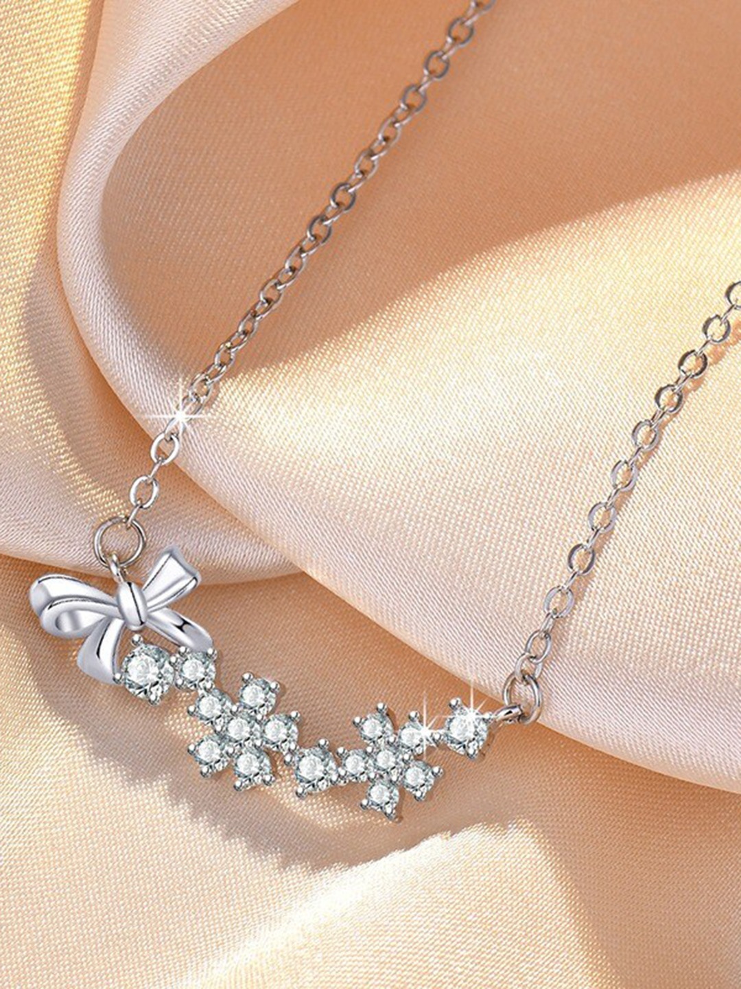 

MYKI Silver-Plated Cubic Zirconia Studded Bow Pendant