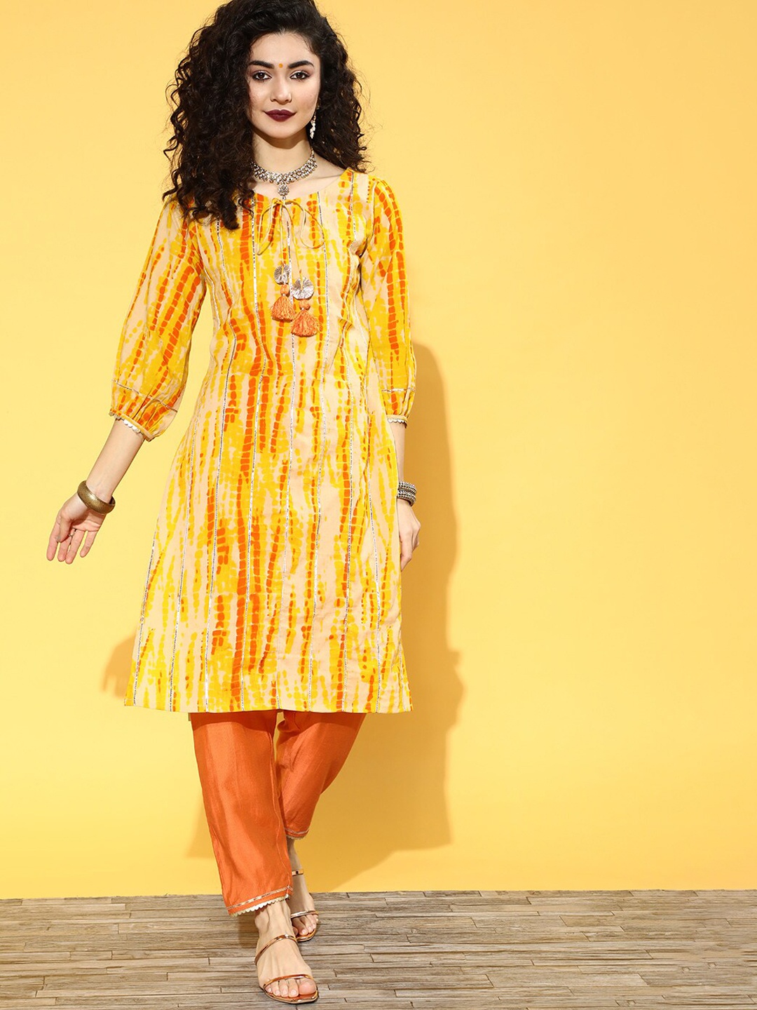 

Indo Era Beige & Yellow Puffed Sleeves Tie-Up Tie & Dye A-Line Kurta