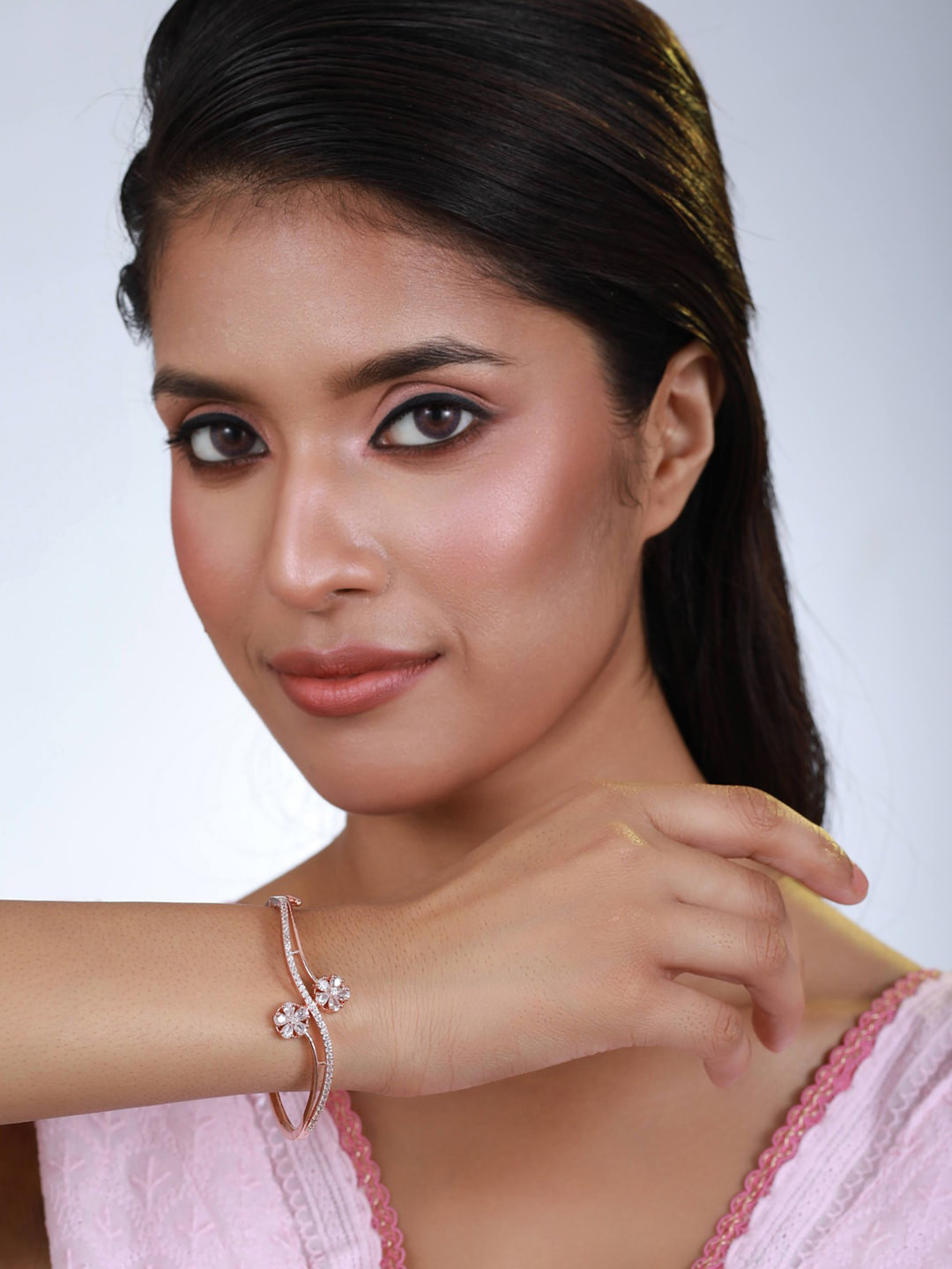 

Anouk Women Rose Gold & White Brass American Diamond Handcrafted Rose Gold-Plated Bangle-Style Bracelet