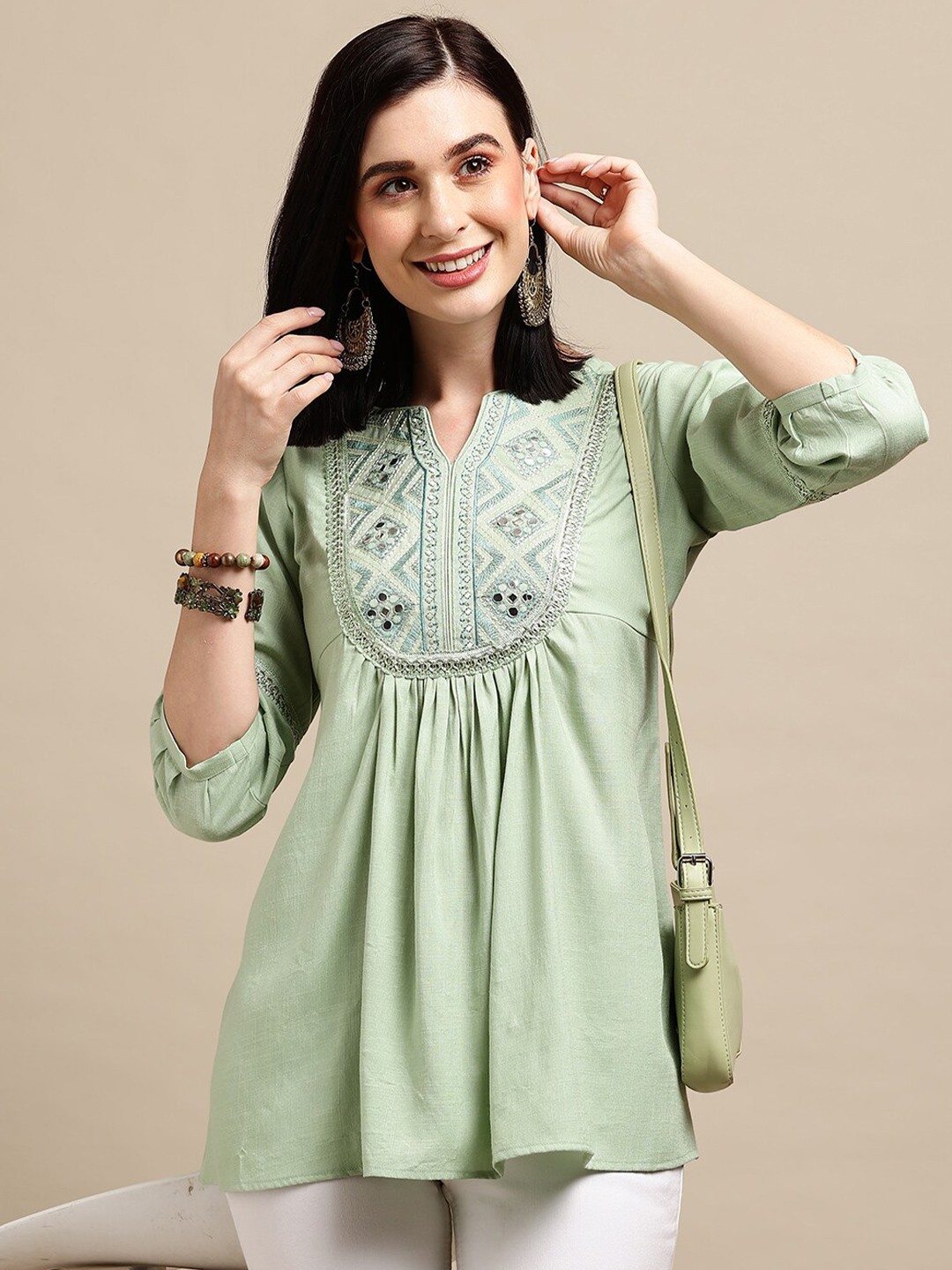 

Sangria Sea Green Ethnic motifs Embroidered Round Notched Neck A-Line Top