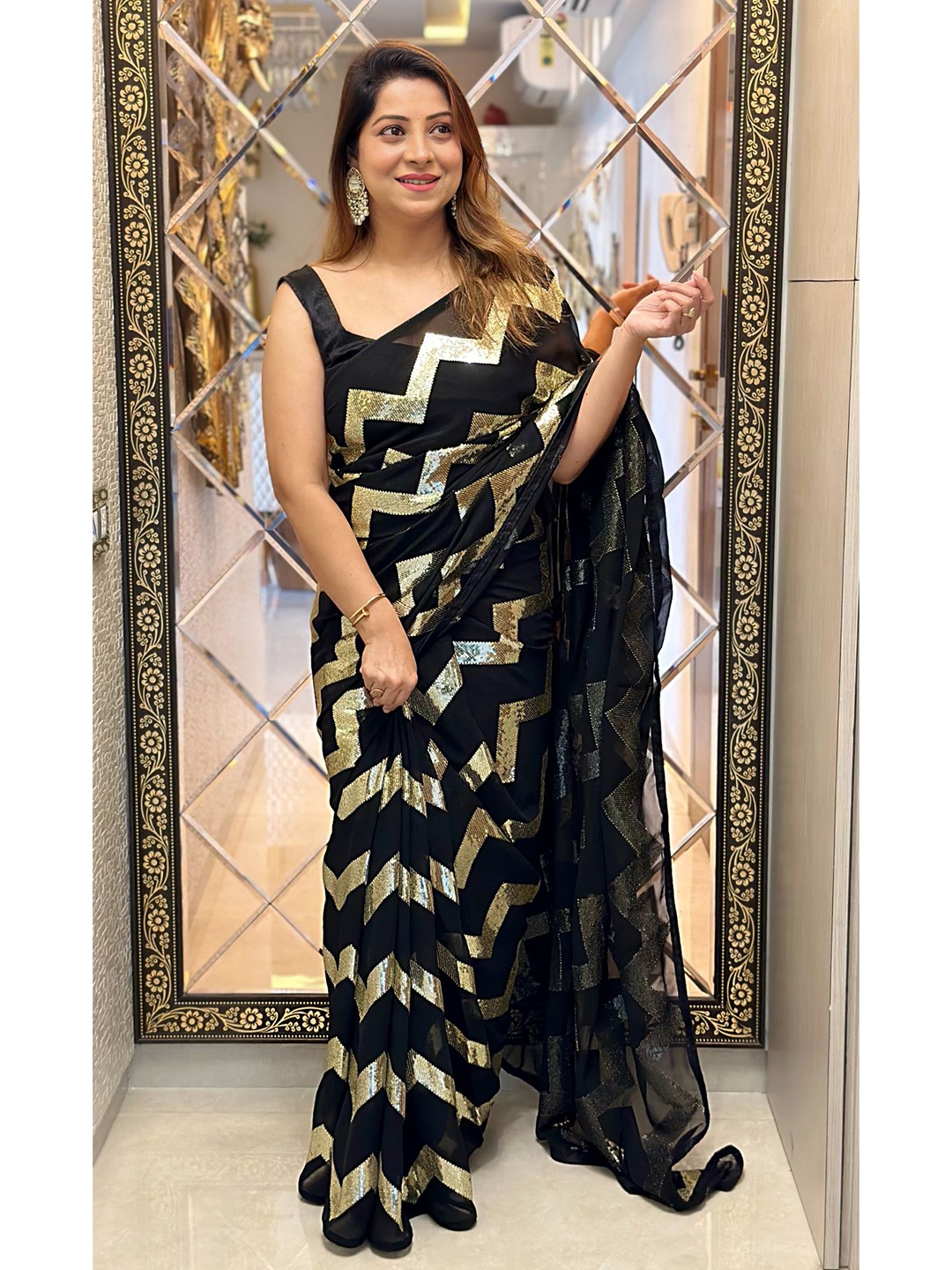 

VAIRAGEE Black & Gold-Toned Embellished Sequinned Poly Georgette Saree