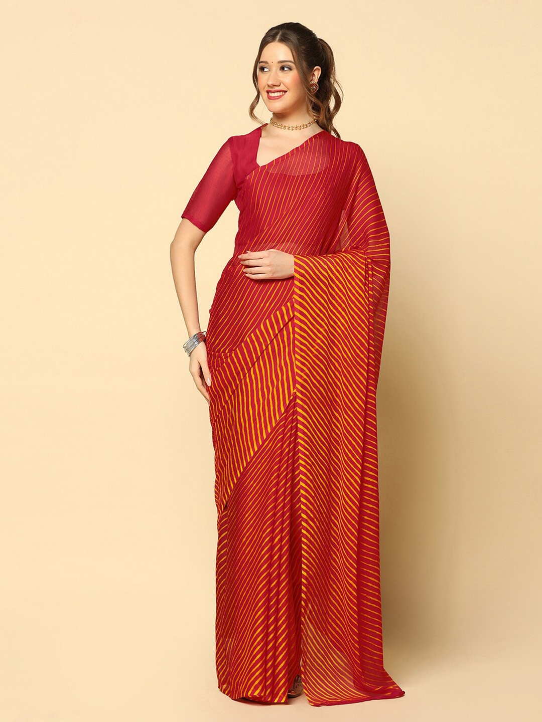 

Mitera Maroon & Orange Leheriya Printed Saree