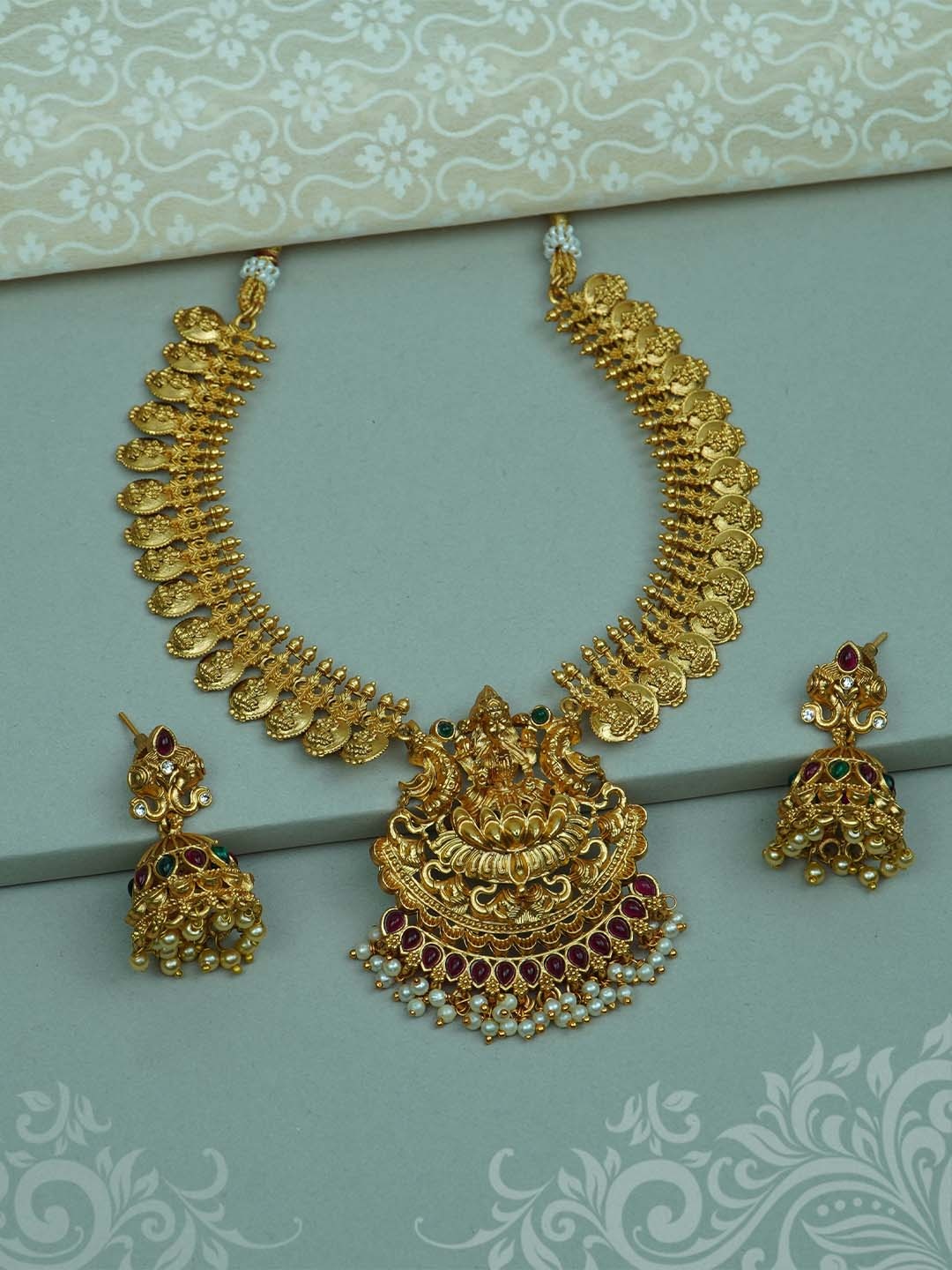 

Diksha collection Gold-Plated Stone-Studded and Pearl Jewellery Set