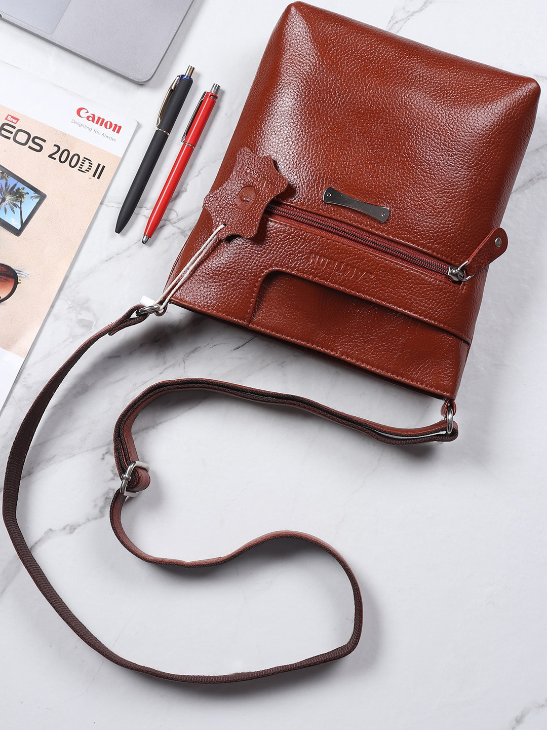

SAMTROH Tan Leather Bucket Handheld Bag with Tasselled