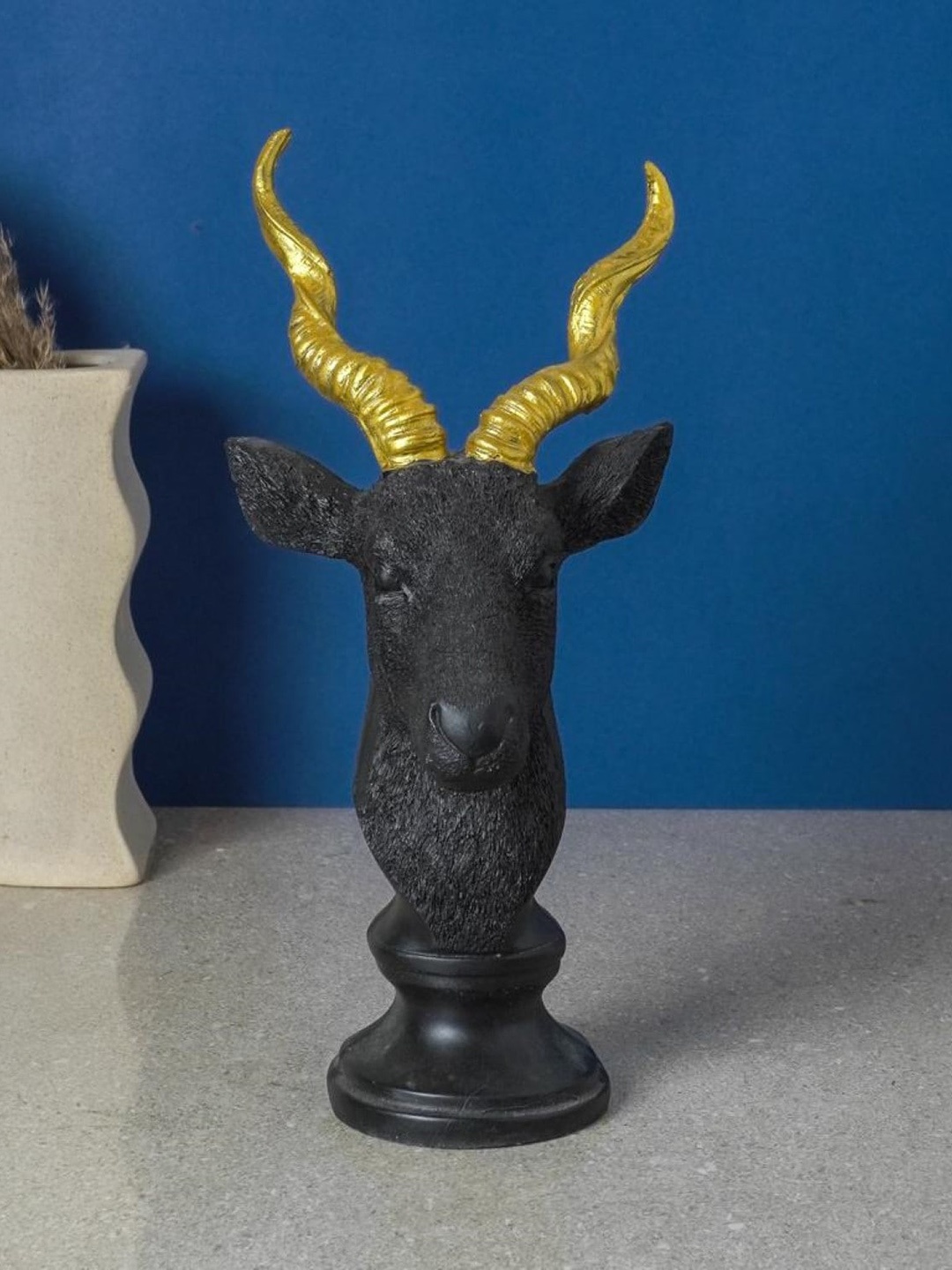 

The Decor Mart Black & Gold Toned Antlelope Table Decor Showpiece