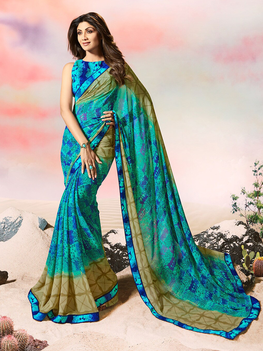 

Shaily Blue & Green Abstract Printed Pure Georgette Saree