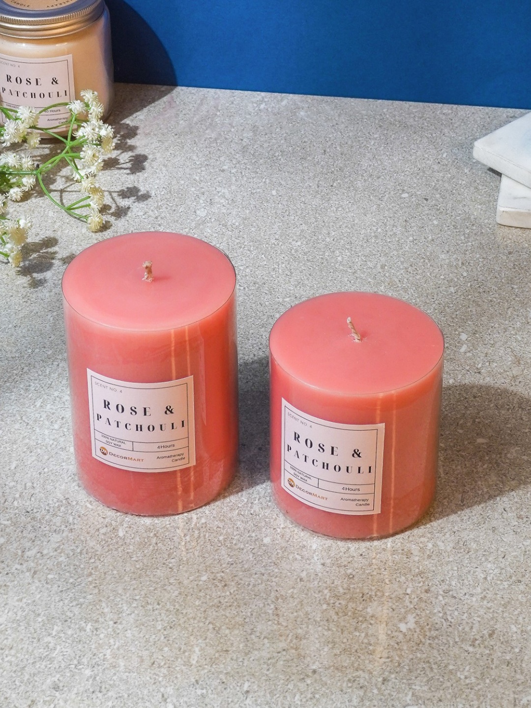 

The Decor Mart Pink 2 Pieces Rose & Patchouli Scented Pillar Candles
