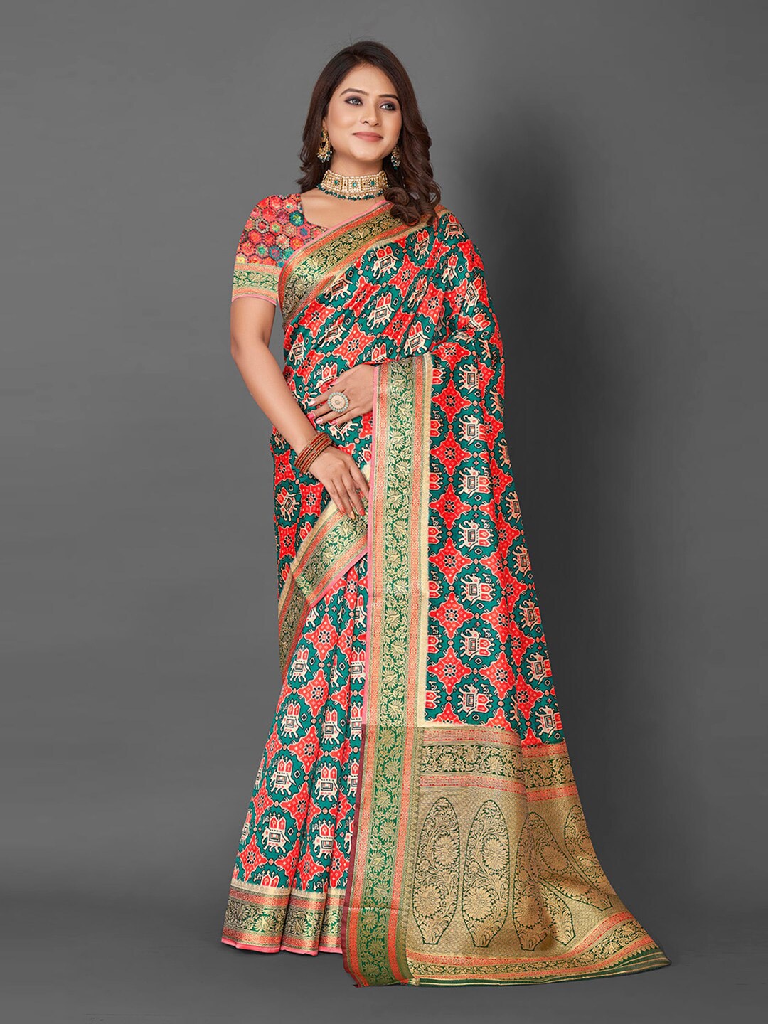 

Mitera Red & Teal Ethnic Motif Woven Design Zari Patola Saree