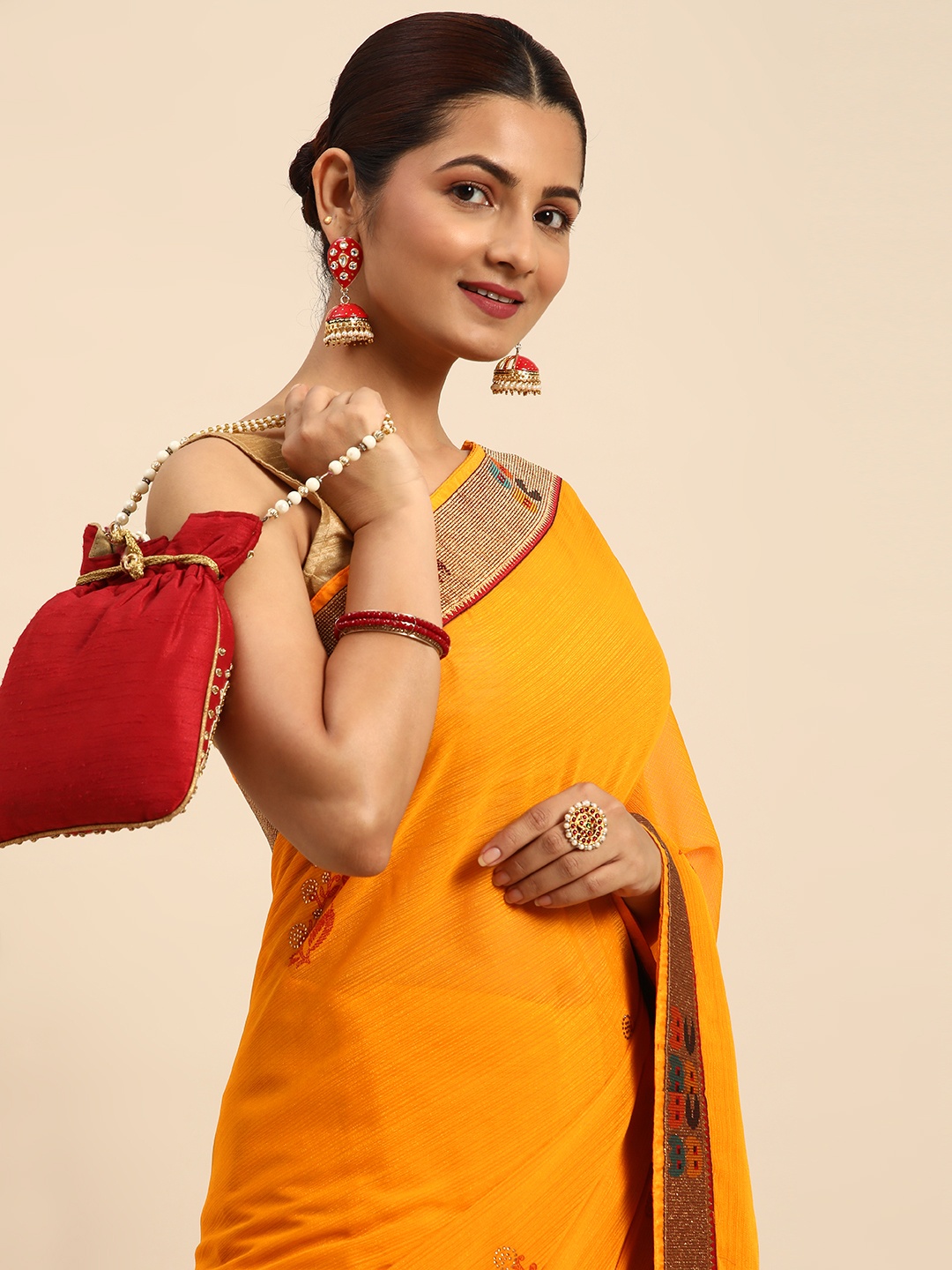 

Indian Women Ethnic Motifs Beads and Stones Designer Saree, Mustard