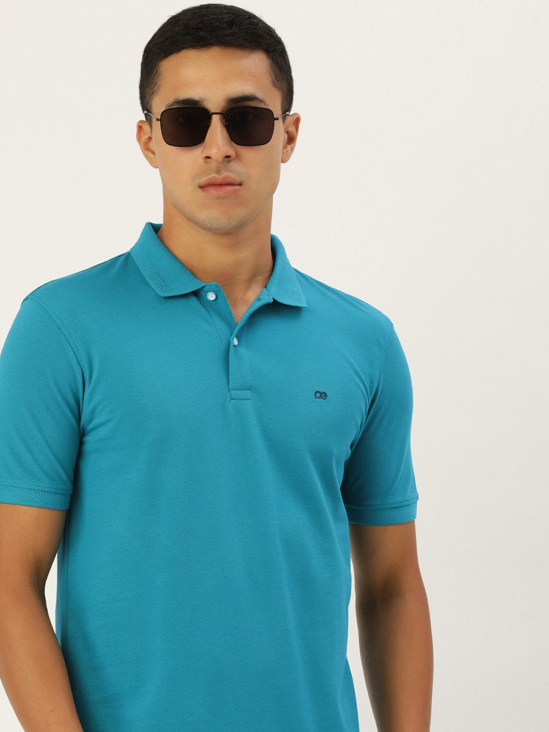 

Peter England Solid Polo Collar Indigo Knitted T-shirt, Teal