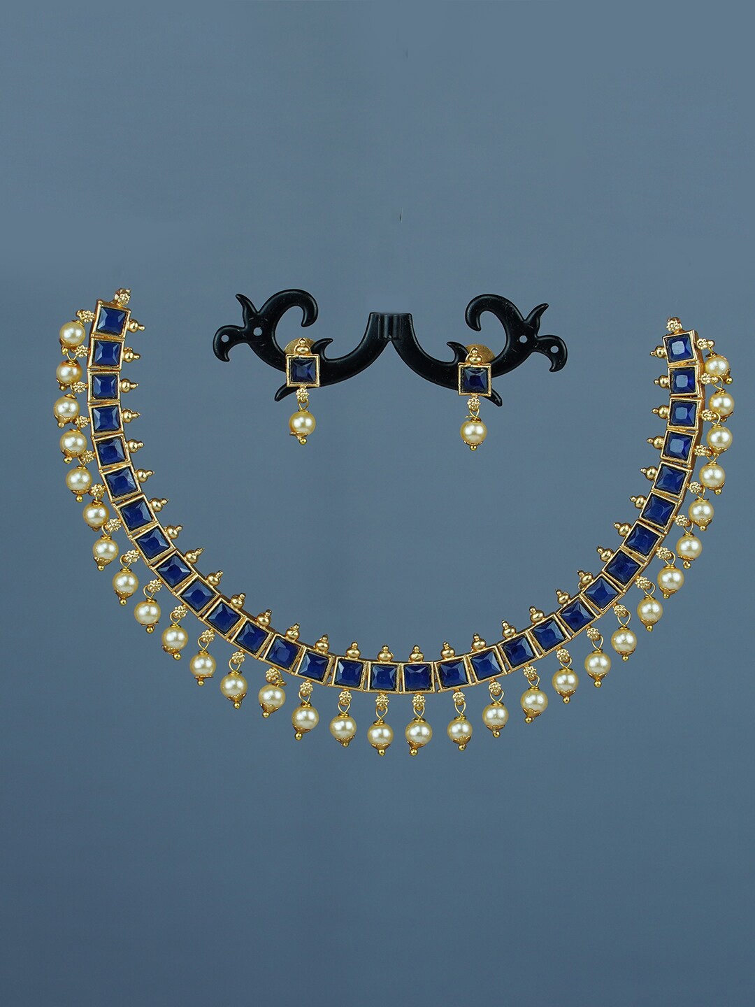 

Diksha collection Gold-Plated Stone-Studded & Beaded Jewellery Set
