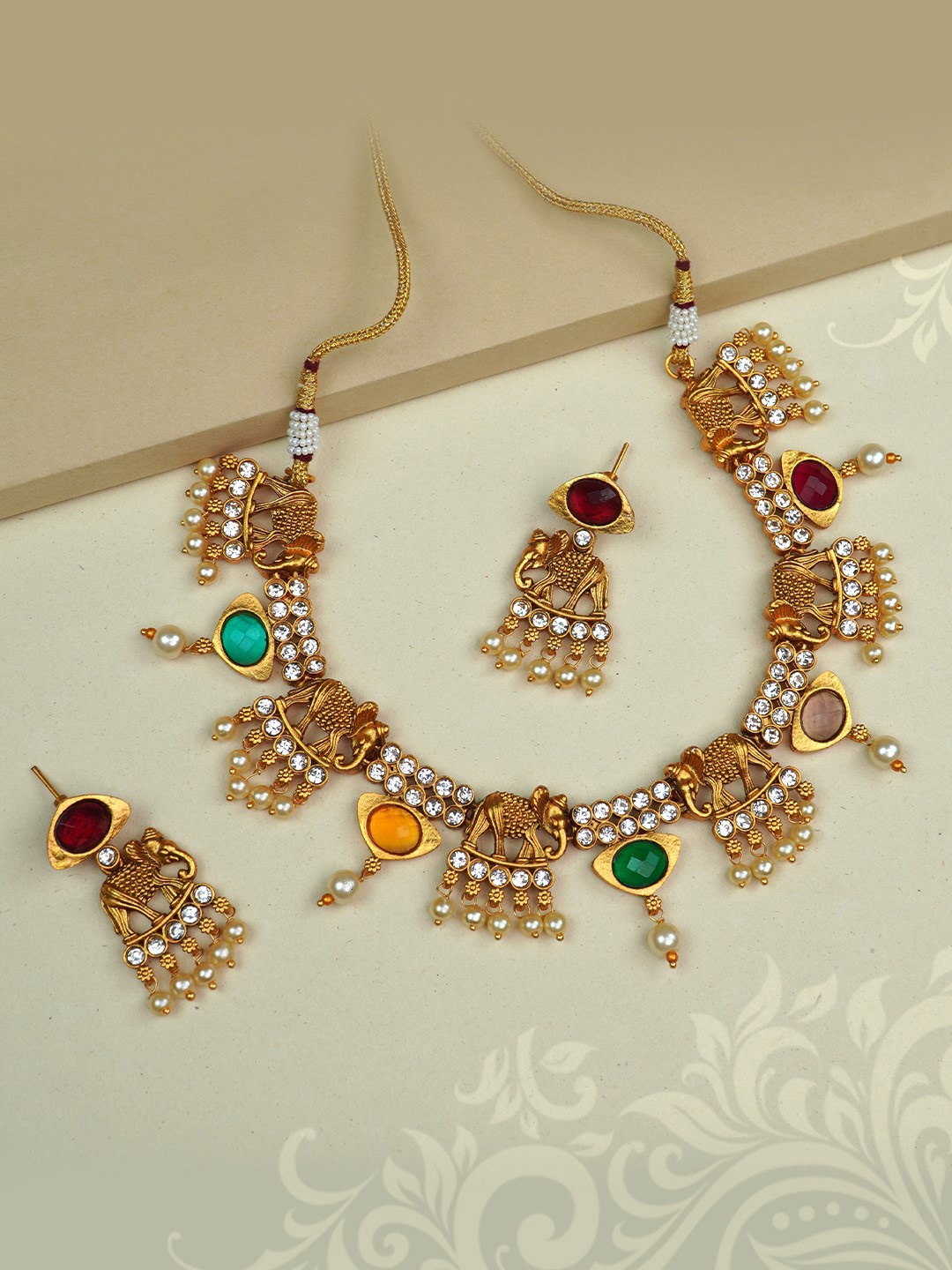 

Diksha collection Gold-Plated Kundan-Studded & Beaded Matte Finish Jewellery Set