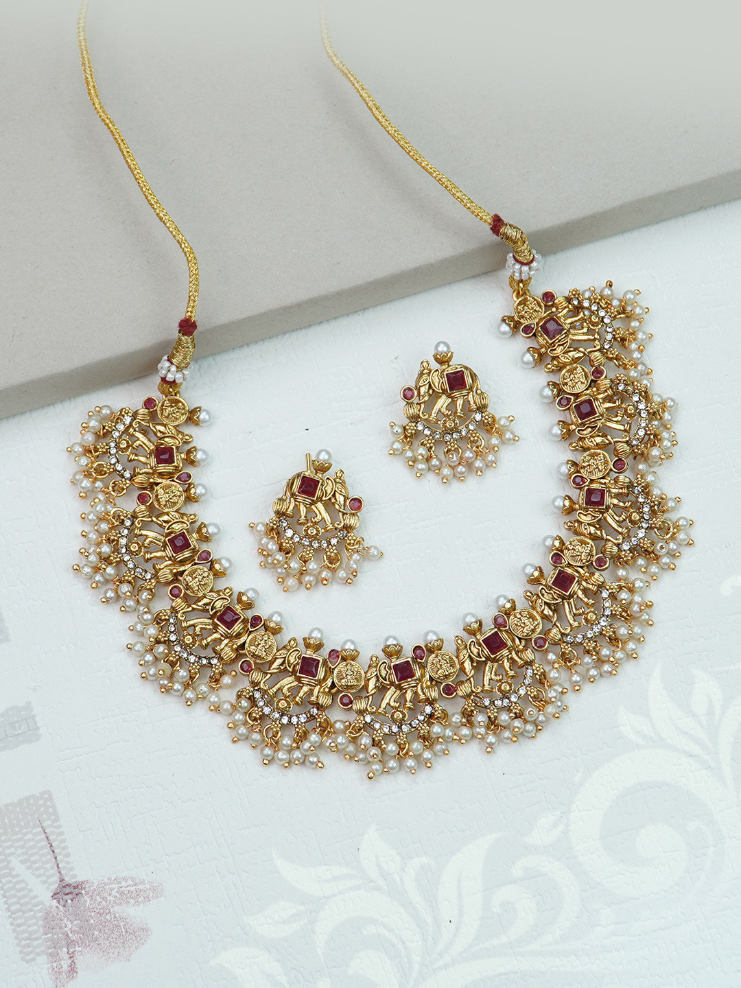 

Diksha collection Gold-Plated Stone Studded Temple Matte Finish Jewellery Set