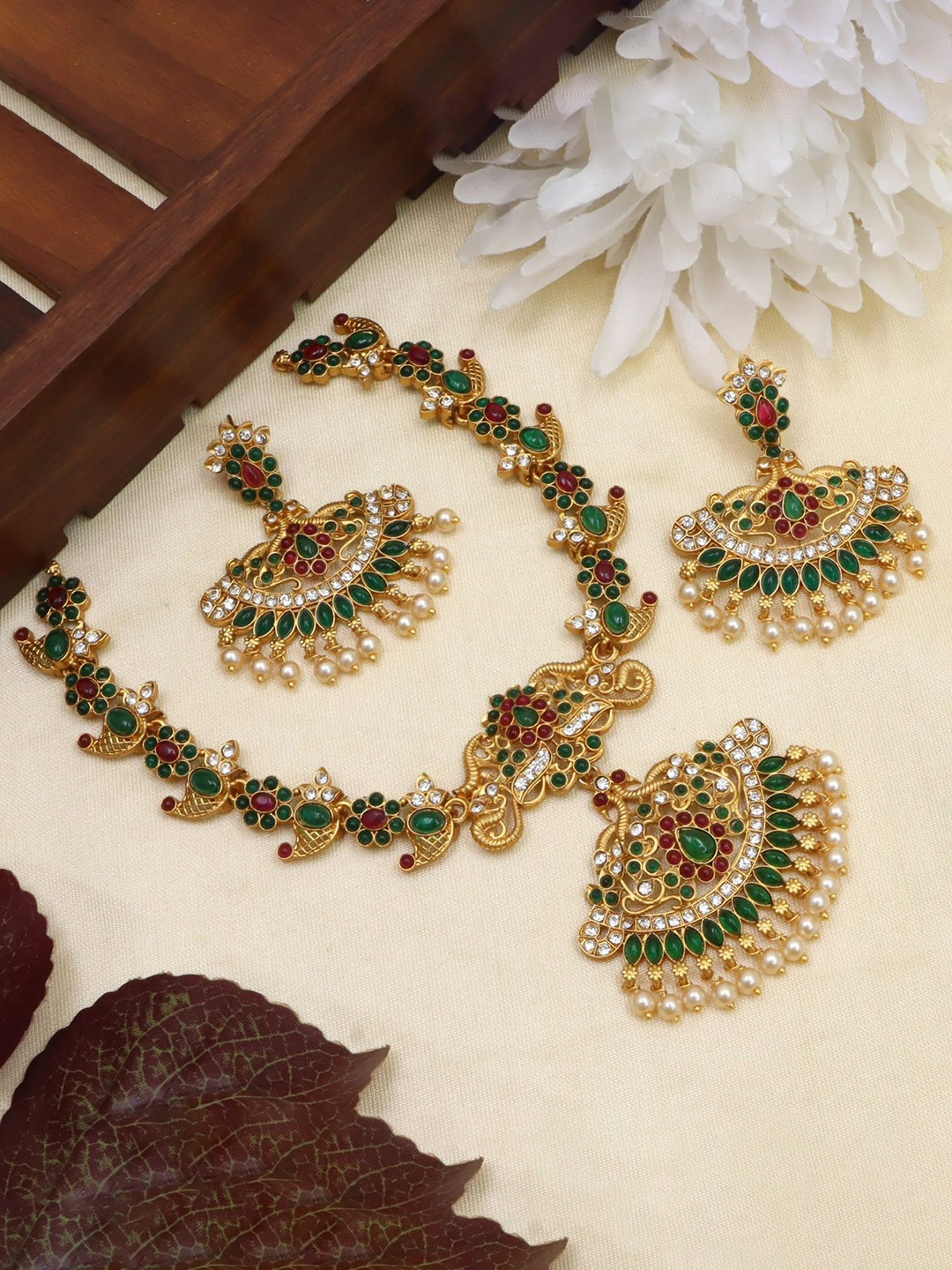 

Diksha collection Gold-Plated Stone-Studded Matte Finish Antique Jewellery Set