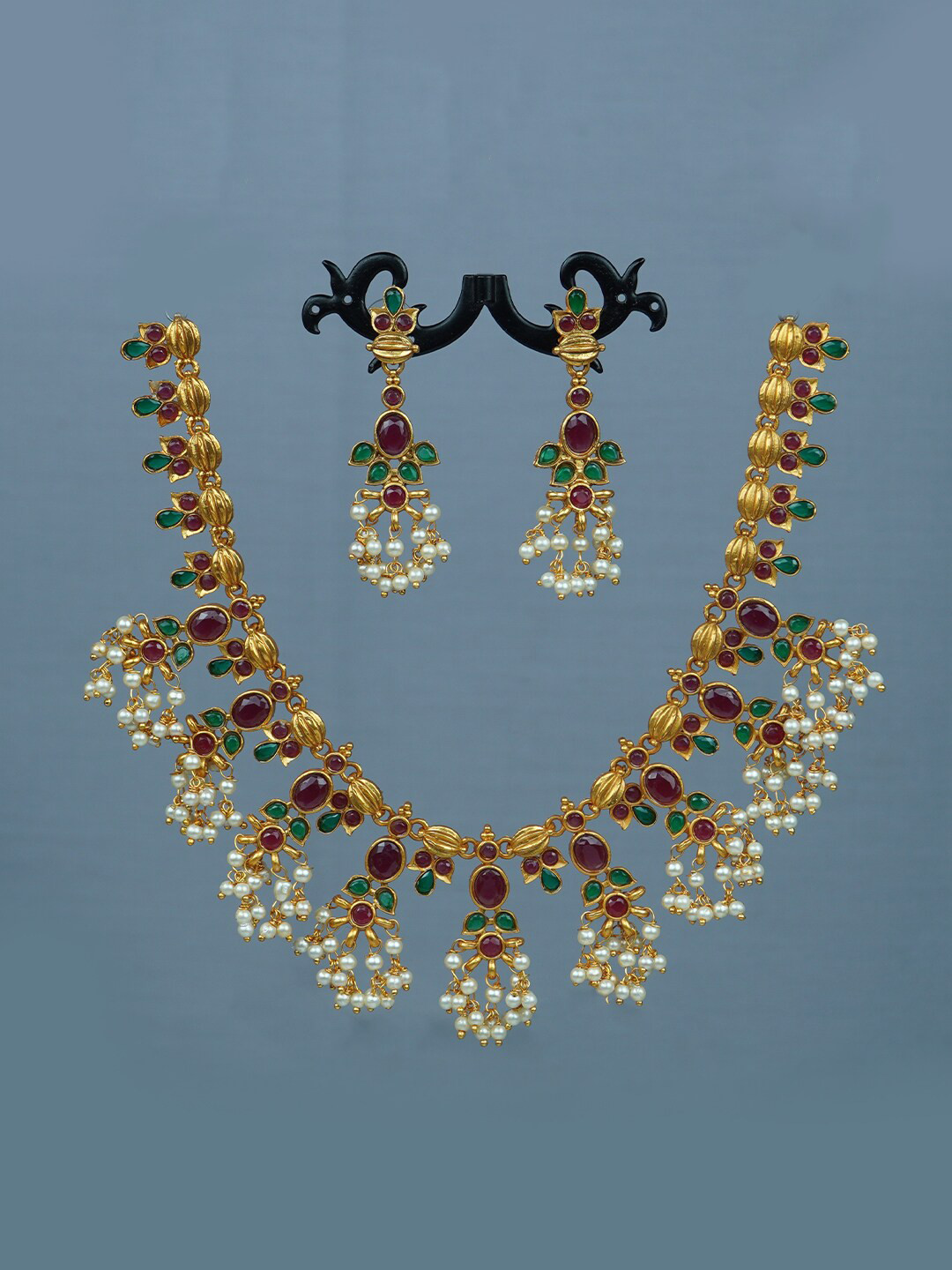 

Diksha collection Gold-Plated Stone-Studded & Beaded Matte Finish Jewellery Set