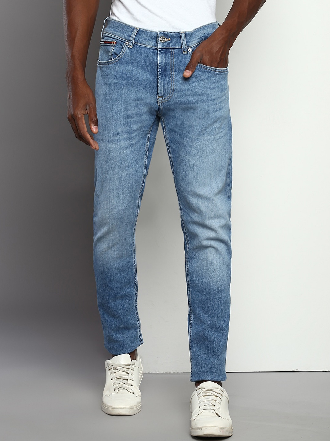 

Tommy Hilfiger Men Tapered Fit Clean Look Light Fade Jeans, Blue