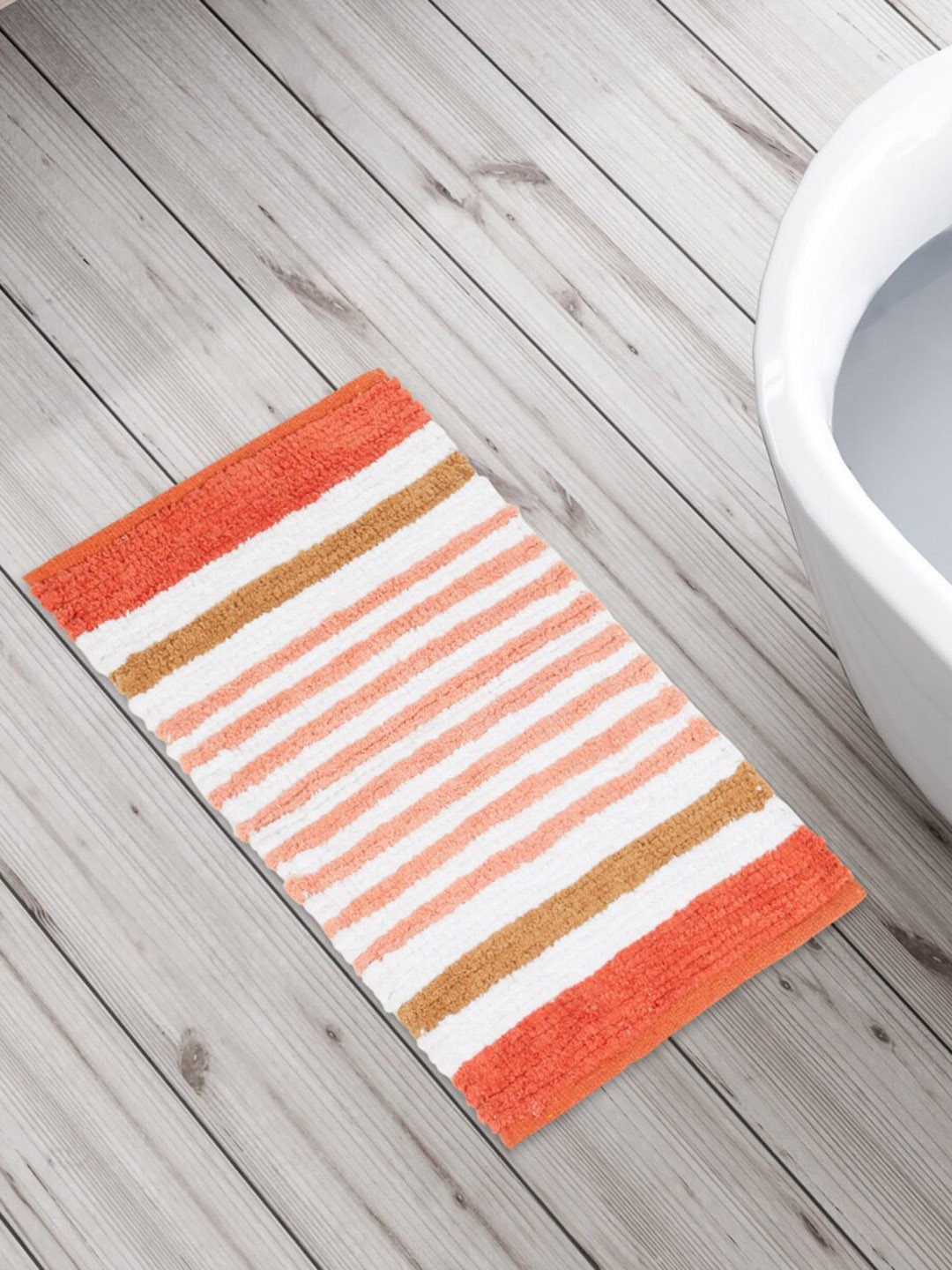 

Home Centre Spinel-Wallet Opener White & Orange-Colored Striped Anti-Skid Bath Mat