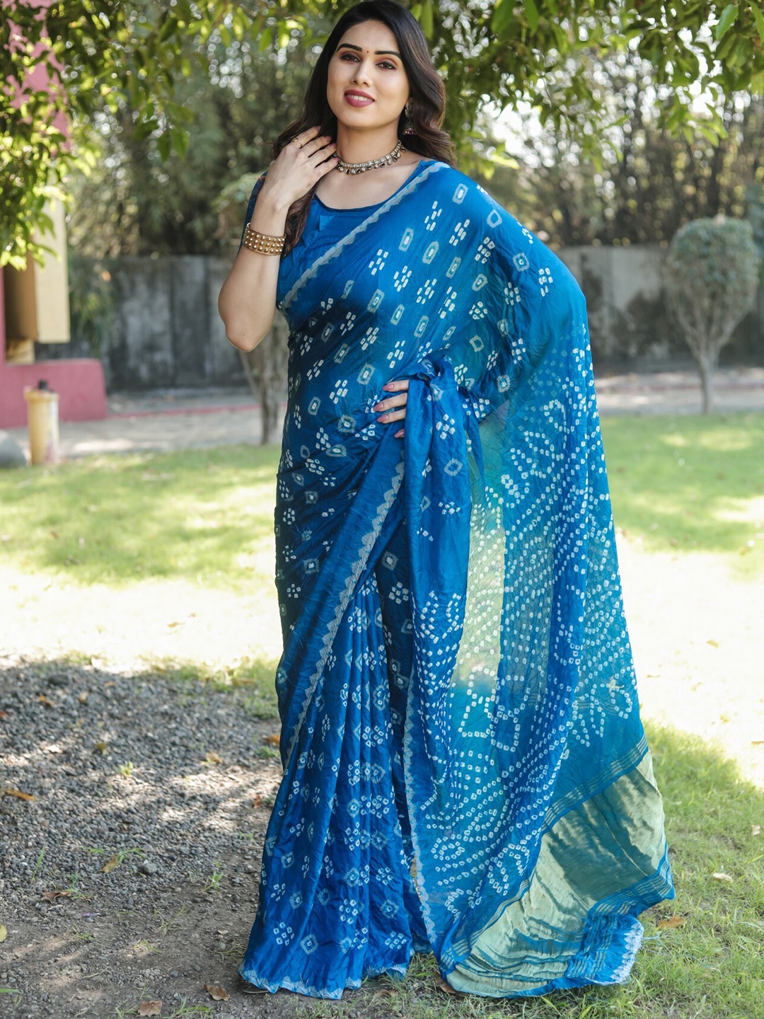 

Mitera Blue & White Tissue Zari Bandhani Saree