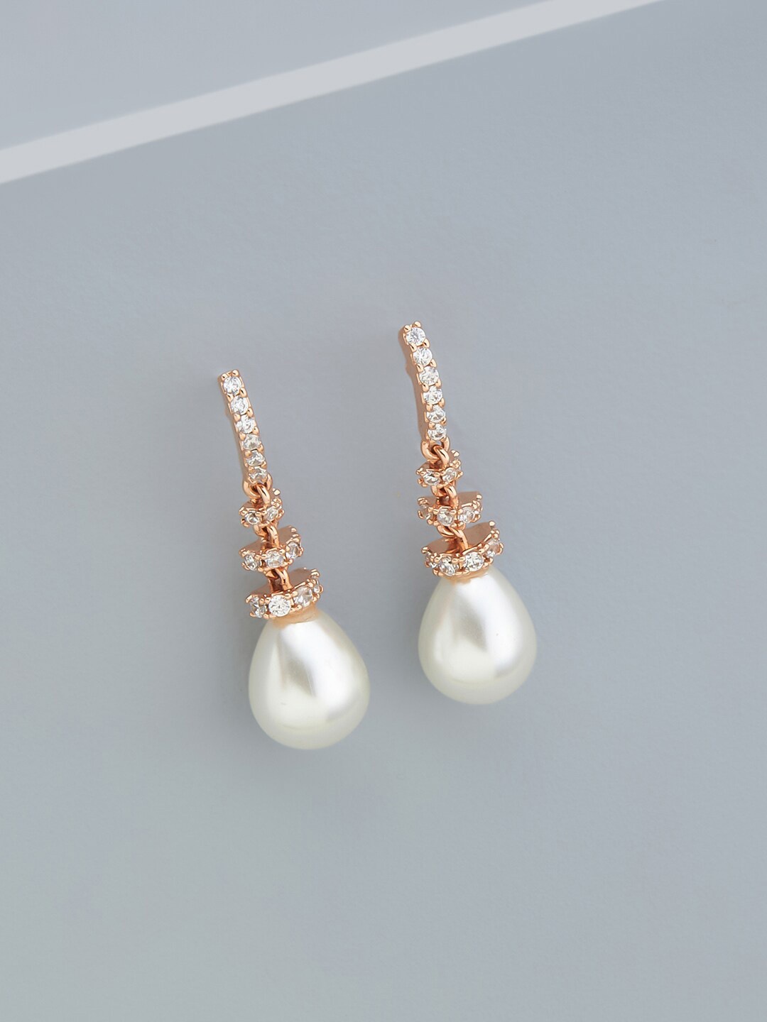

Kushal's Fashion Jewellery Rose-Gold Plated Teardrop Shaped Studs Earrings