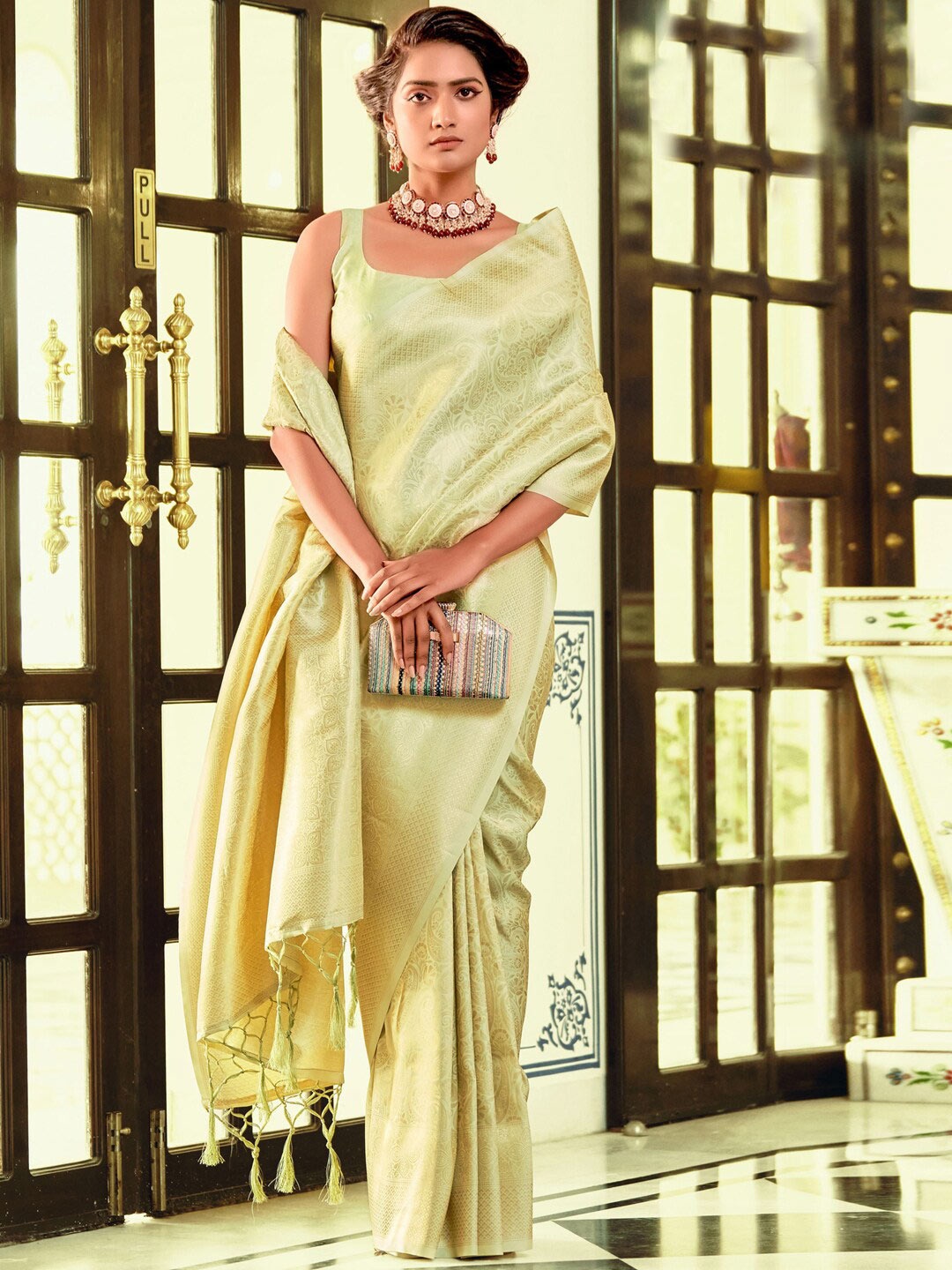 

Mitera Lime Green & Gold-Toned Ethnic Motif Woven Design Zari Banarasi Saree