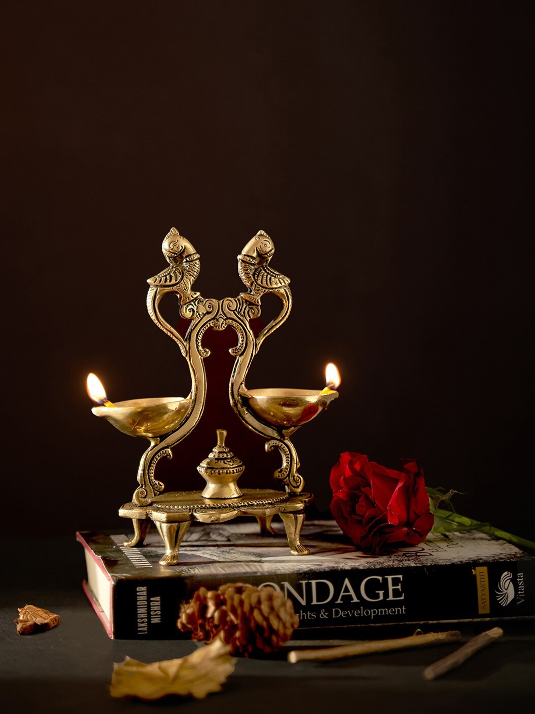 

DecorTwist Gold-Toned Twin Peacock Shaped Oil Wick Brass Diya