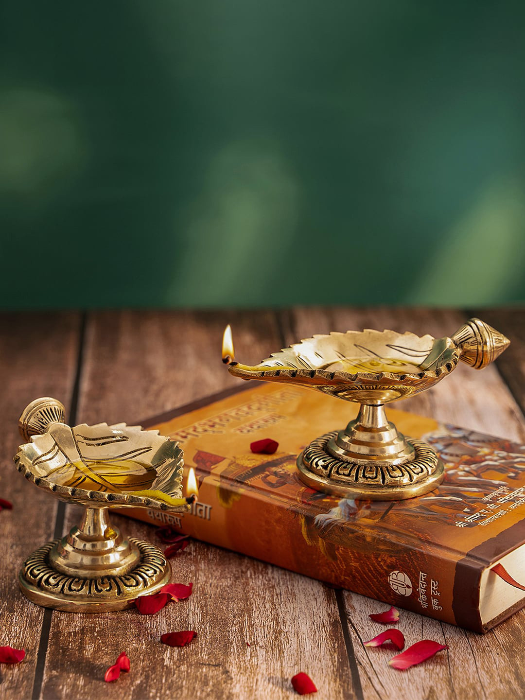 

DecorTwist Gold Toned Brass Leaf Shaped Diya