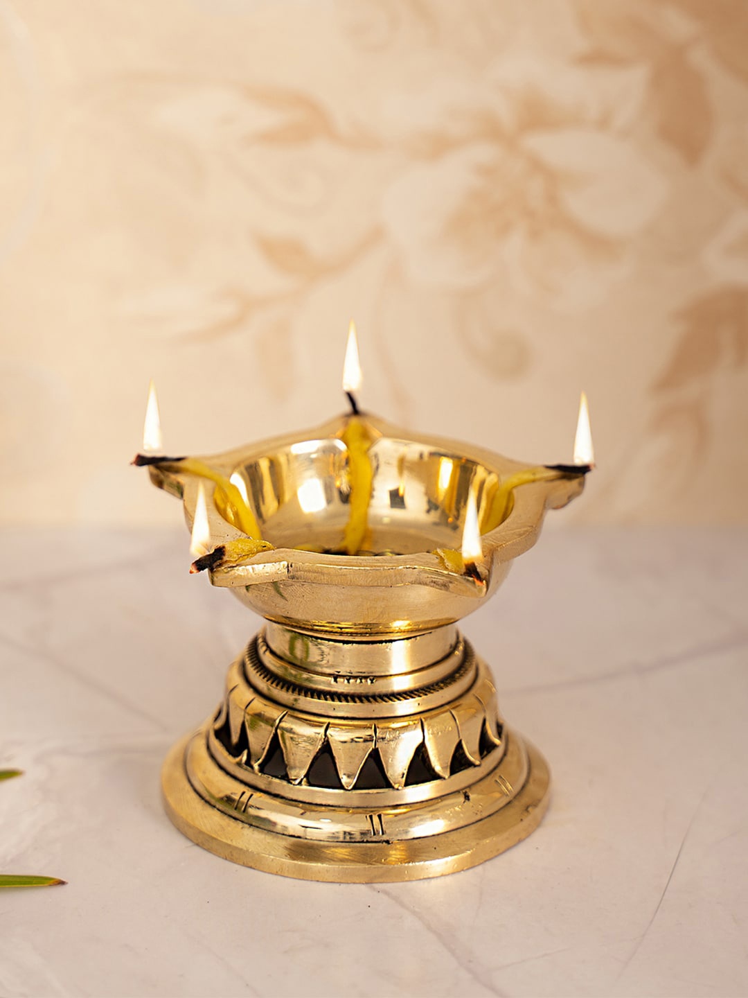 

DecorTwist Gold-Toned Brass Diya With 5 Wicks