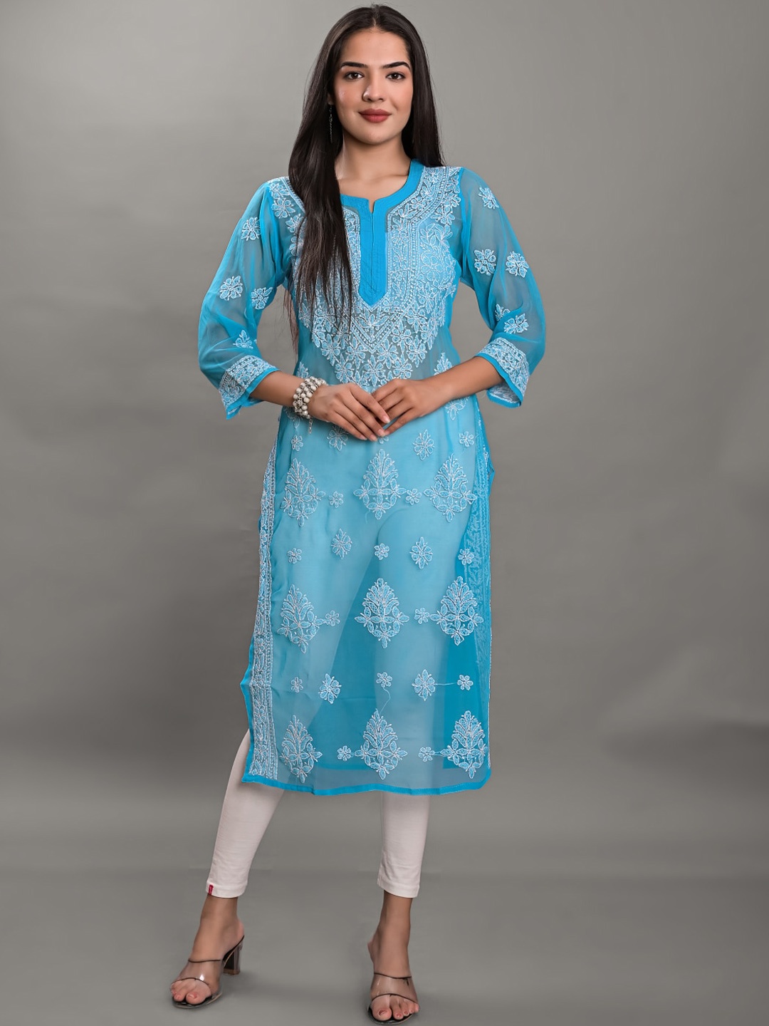 

Apratim Turquoise Blue & White Ethnic Motifs Embroidered Chikankari Georgette Kurta