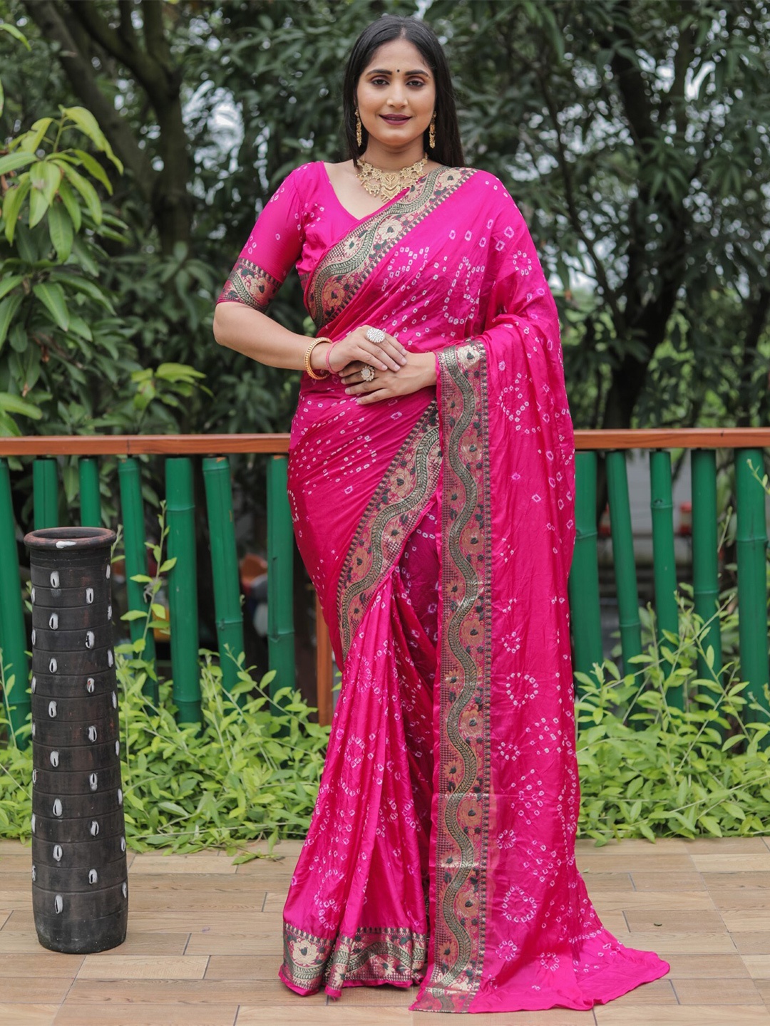 

Mitera Pink & White Bandhani Printed Zari Saree