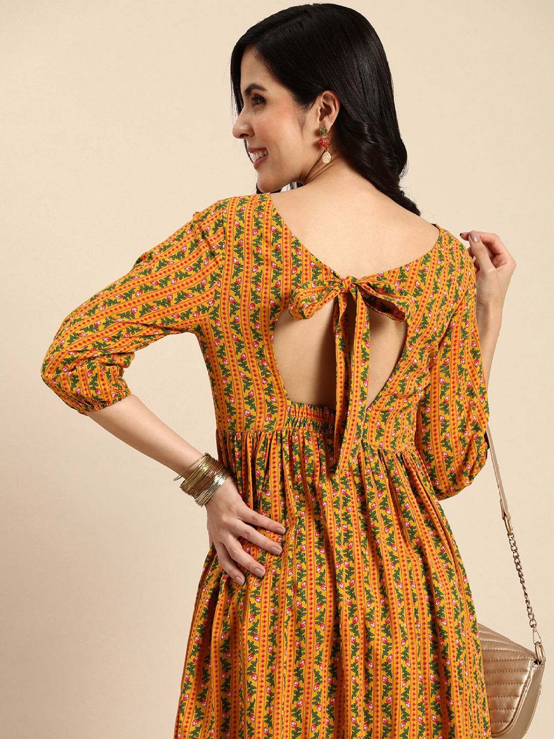 

Anouk Ethnic Motifs Printed & Striped Styled Back Smocked Detail A-Line Kurta, Mustard