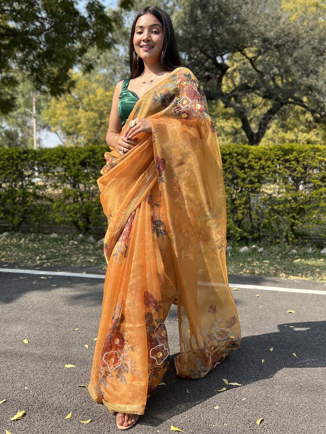 

Atulyam Tex World Floral Printed Embellished Organza Saree, Rust