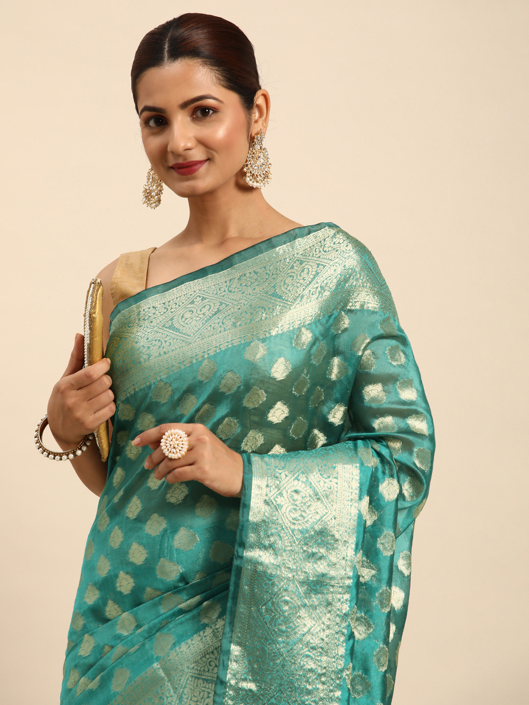 

Indian Women Teal & Gold-Toned Woven Design Zari Organza Banarasi Saree