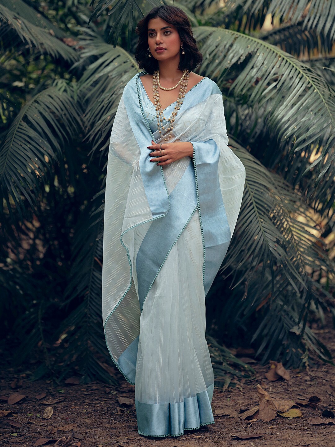 

Stylee LIFESTYLE Turquoise Blue & Silver-Toned Woven Design Zari Organza Saree