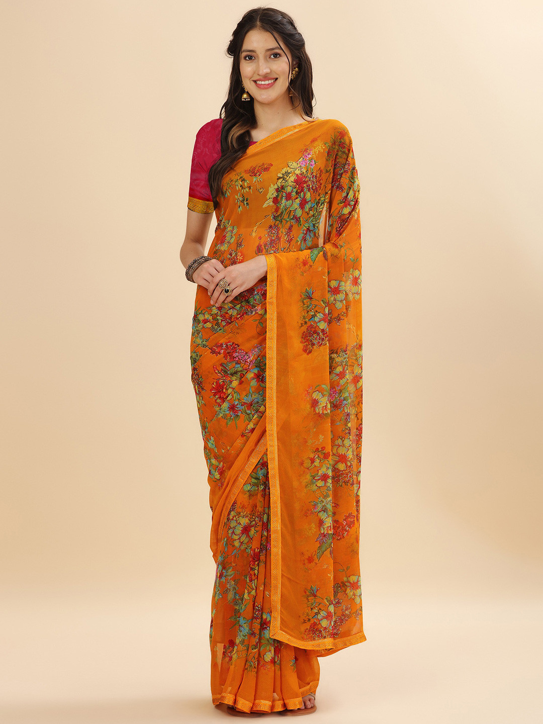 

Mitera Yellow & Blue Floral Stone Work Pure Georgette Saree