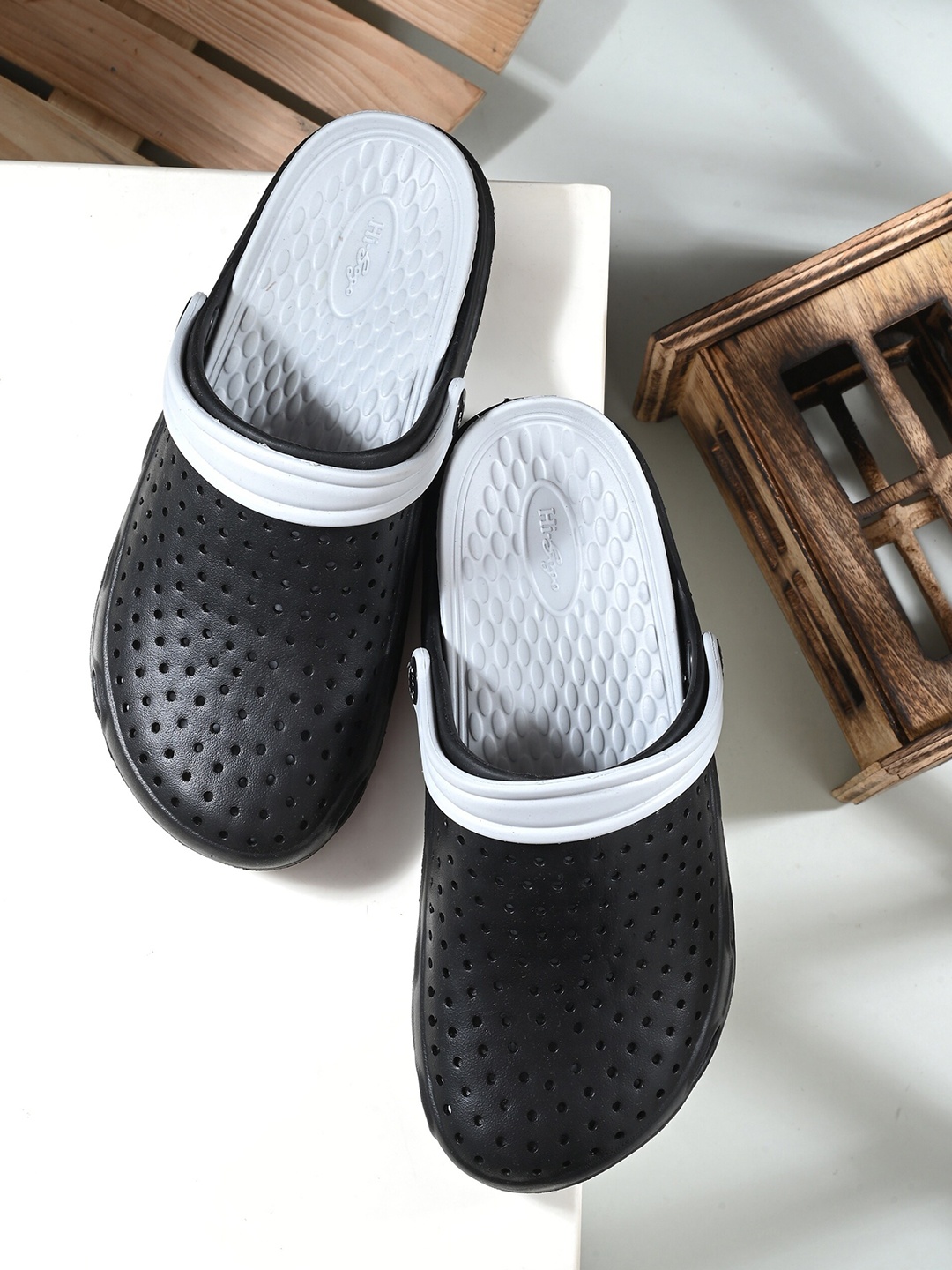 

Mast & Harbour Men Black And White Self Design Croslite Clogs