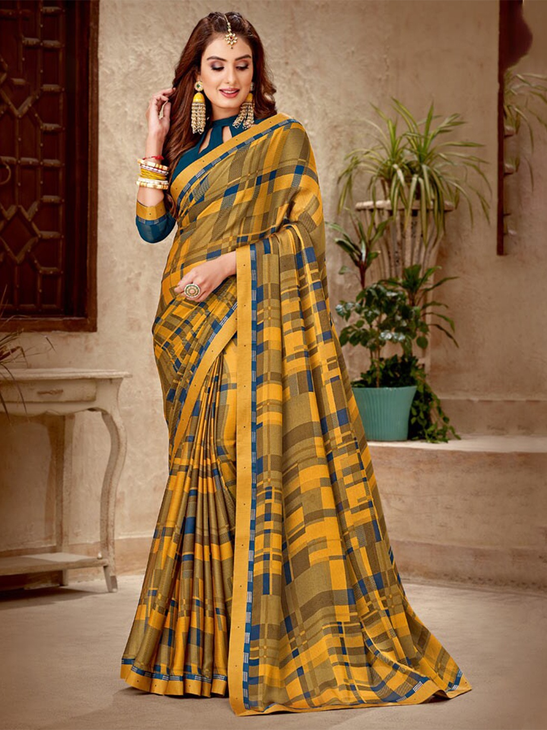 

Vishal Prints Orange & Blue Poly Chiffon Saree