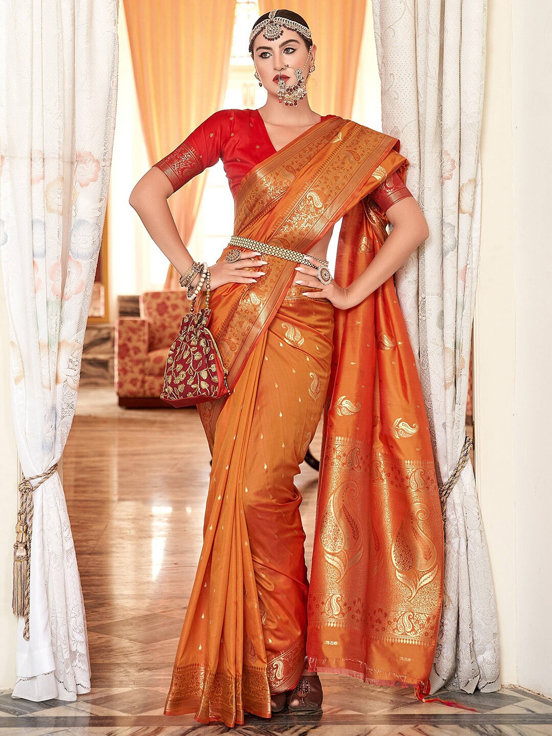 

Satrani Orange & Gold-Toned Ethnic Motif Woven Design Banarasi Saree