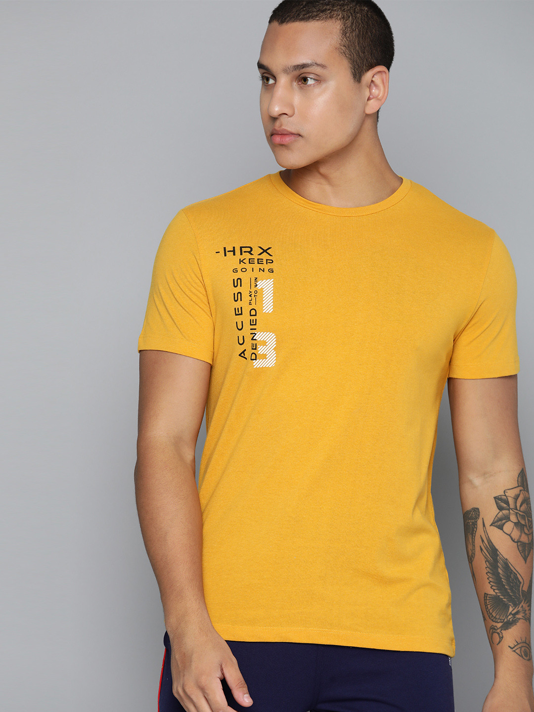 

HRX by Hrithik Roshan Men Brand Logo Printed T-shirt, Mustard