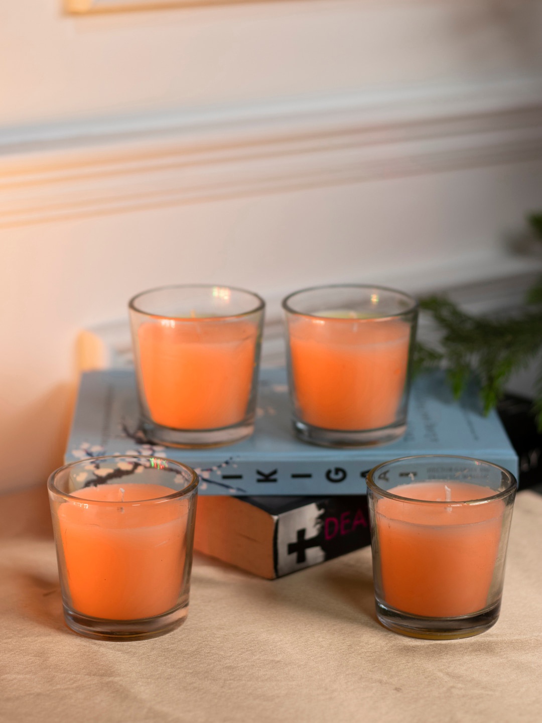 

Dhrohar Oriental Elegance Orange-Colored 4 Pieces Blossom Scented Votive Candles