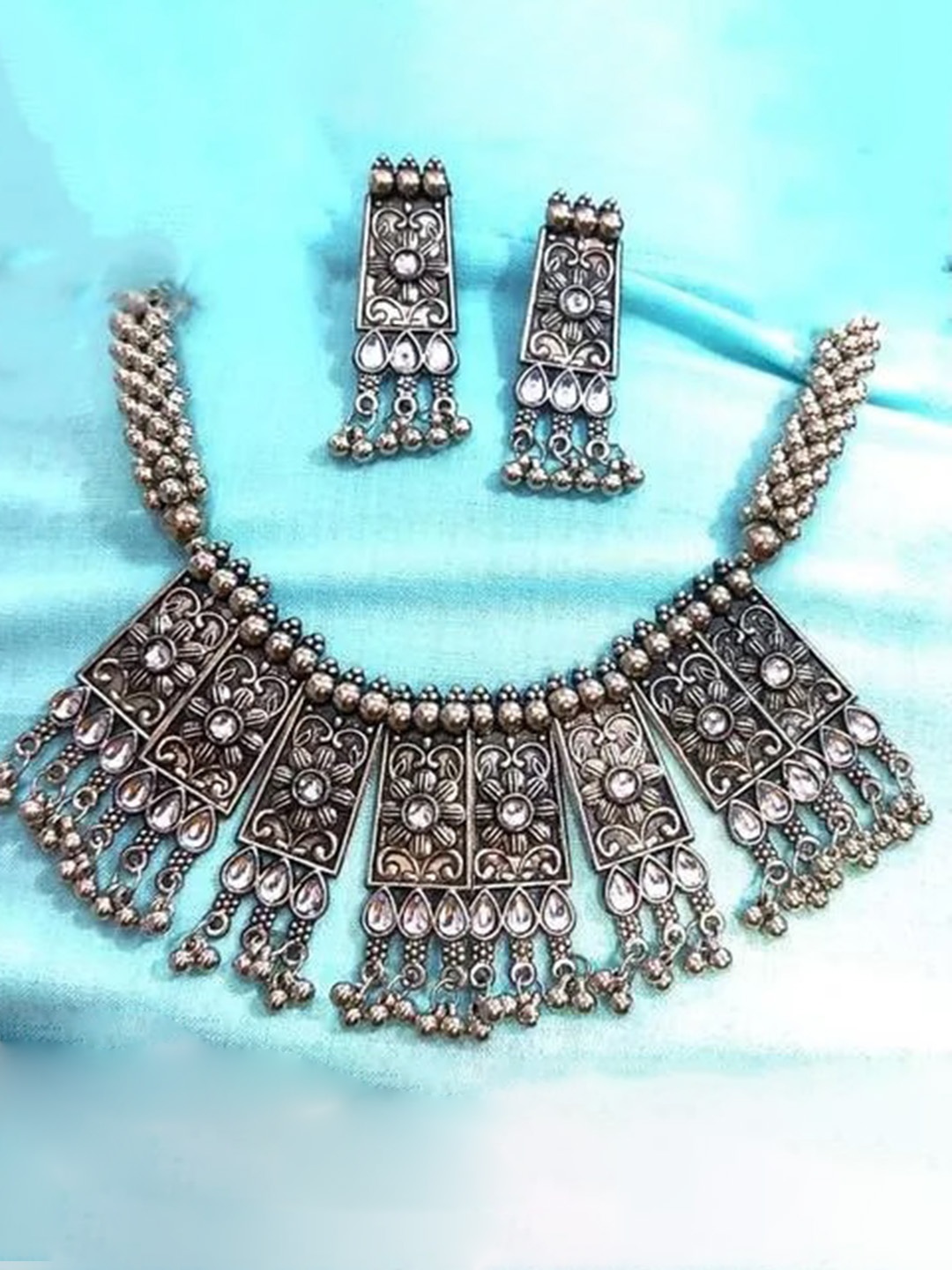 

Samridhi DC Silver Plated Stone-Studded & Beaded Oxidised Afghan Jewellery Set