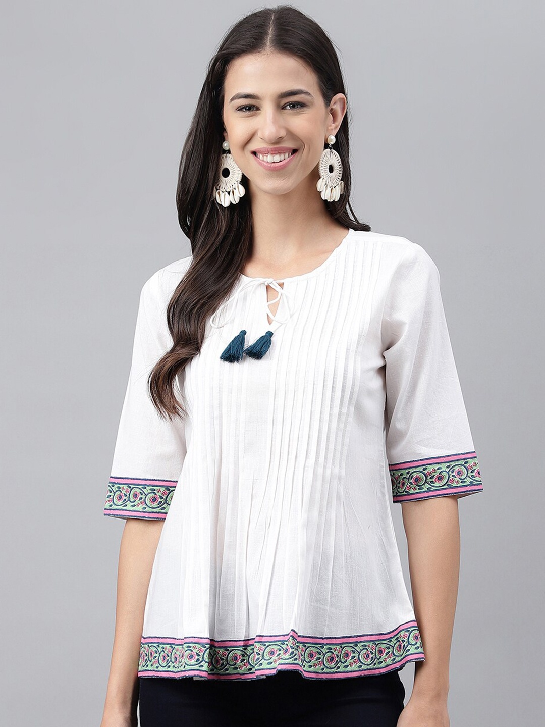 

Janasya White Ethnic Motifs Printed Tie Ups Neck Accordian Pleats Cotton A-Line Top