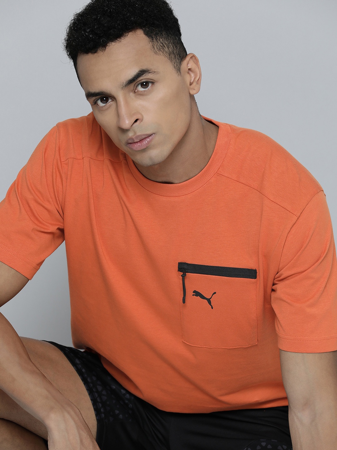 

Puma Brand Logo Printed OPEN ROAD dryCELL Pocket Relaxed Fit T-shirt, Rust