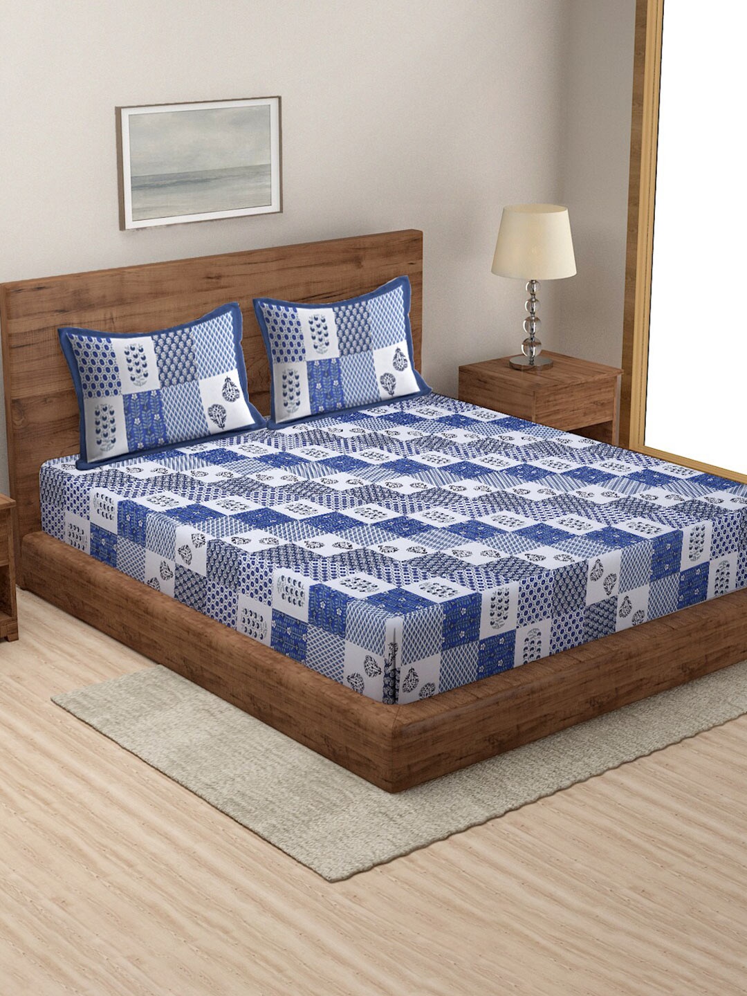 

Rajasthan Decor White & Blue Geometric 144 TC Cotton Queen Bedsheet with 2 Pillow Covers